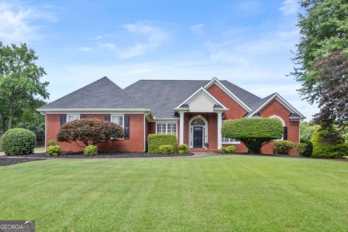 This beautifully maintained 4-sided brick home offers luxury, comfort, and abundant space with 6-bedrooms, and 5.5 bathrooms. Enjoy peace of mind with a new roof (2021), new windows and patio doors along the back of the home, and new HVAC/furnace systems on both the main and upper levels, plus a newer furnace for the basement. The interior was freshly painted in 2023, and the deck and patio area received a refresh in 2024-including under decking for year-round enjoyment. The primary, main level bedroom has access to the porch with golf course and sunset views. The master bathroom has been completely remodeled and has with a new front window. There are new window treatments on the back of the home and new shutters on the front facing windows in the dining room and office. The chef's kitchen boasts a new double oven and is ideal for entertaining. The basement has a full in-law suite with separate entrance, a full kitchen, washer/dryer, and all appliances included. Additional features include a 3-car garage, ADT security system, Invisible Fence, irrigation system, and reverse osmosis/whole-home water system. This is a rare opportunity to own a move-in ready home with golf course views, multiple living spaces, and high-end upgrades throughout. Don't miss it-schedule your showing today!