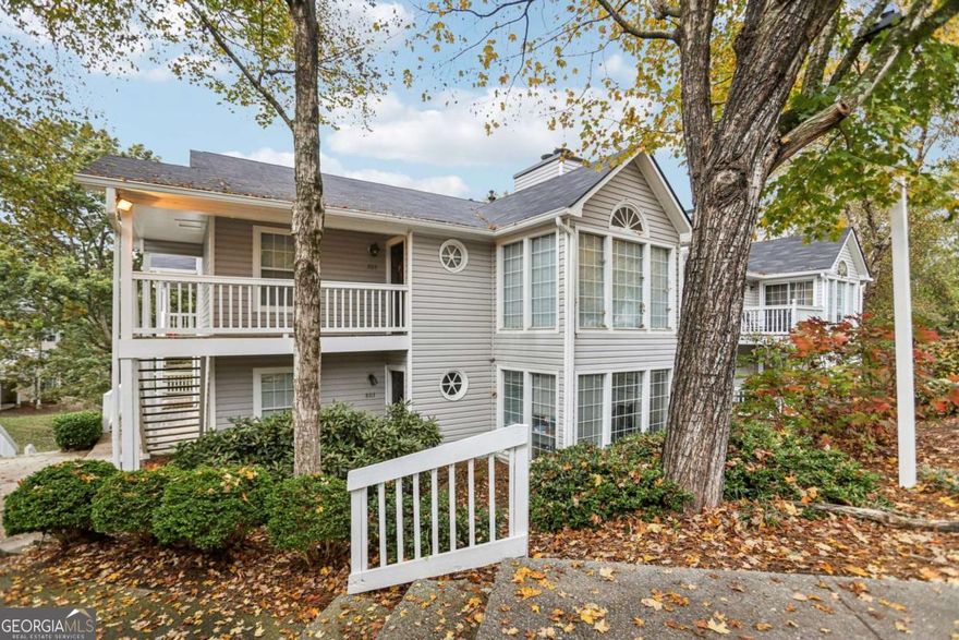 Tucked away at the back of the community, this 2-bedroom, 2-bath condo offers privacy galore with peaceful views of open green space. Inside, you'll love the spacious sunroom, perfect for a home office or morning coffee spot, and a cozy fireplace that anchors the inviting living room. Step out onto your private balcony to enjoy the quiet surroundings and natural scenery.  The interior has been freshly painted so you can move right in!    Located in the heart of Smyrna, this home gives you unbeatable access to Truist Park and The Battery, Cumberland Mall, and a variety of top dining and nightlife spots. Commuting is a breeze with easy access to I-285, I-75, I-85, and the Atlanta Airport. The community boasts a pool, tennis courts and plenty of room for walking the dogs!    This condo offers flexibility for every kind of buyer - owner/occupant, investor or anyone looking to have a low-maintenance place near the city!