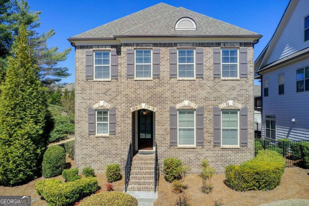 Introducing this beautiful move-in ready property located in a highly desirable Milton zip code with Forsyth County taxes. Over the past few months, this property has gone through an extensive inspection to ensure that all aspects of the interior and exterior are maintained and ready for the next owner. This property provides an incredibly rare opportunity to own one of the largest plots in the entire development with ample side yard space, adding unmatched privacy and entertainment space. The home features a spacious and open main living space, including an attached living, kitchen, and dining room perfect for entertaining. Freshly painted kitchen cabinets and interior and exterior paint add a fresh shine throughout. Primary bedroom directly on the main level includes a large walk-in closet with ample space. The primary bathroom includes large dual vanity sinks and an impressive bathtub. The upstairs floor features two bedrooms with a joining bathroom plus a large retreat space perfect for an additional living space plus a loft area. The neighborhood amenities include a large community pool with attached tennis courts and a unique set of private walking trails.
