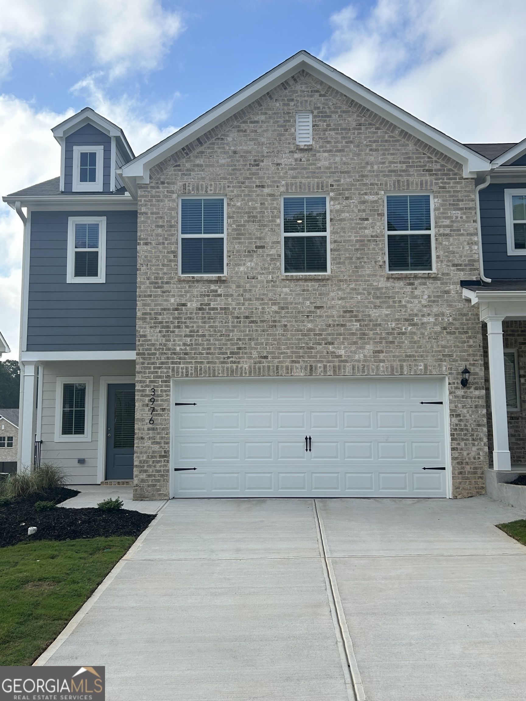 Welcome to the Laurel - Your Perfect Place to Call Home This spacious 4-bedroom, 2.5-bath home with a two-car garage is designed with both comfort and convenience in mind. With a gorgeous exterior accented by a subtle pop of color, the Laurel offers a stylish canvas for homeowners to make it uniquely their own. Enjoy plenty of parking options with space in your garage, driveway, nearby street, and convenient guest parking just steps away. Ideally located near the community mailboxes, close to the front entrance, and a short walk from the playground-this home brings everyday ease right to your doorstep. Whether you're enjoying a sunny afternoon stroll, sitting on your cozy front porch, or watching your kids play outdoors, the Laurel at Oakwood Terrace is all about lifestyle. Stop in today to get a personal tour of this property! We can't wait to hand you the keys to your new home!