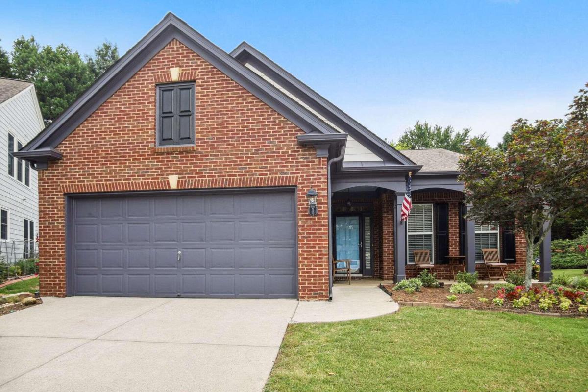 Welcome to this one-level ranch home in sought after Peachtree Court community! Open floorplan featuring kitchen and eat-in with views to the family room and sunroom. Separate dining room for those family get togethers. The den makes a great office with built-in bookshelves or potential 3rd bedroom. The enclosed sunroom can be used year round and will become your favorite spot for morning coffee! Beautiful and maintenance free landscaping on one of the largest lots in the community! Fantastic location close to GA 400, The Connections, great shopping, and restaurants. You will love this warm and inviting community!