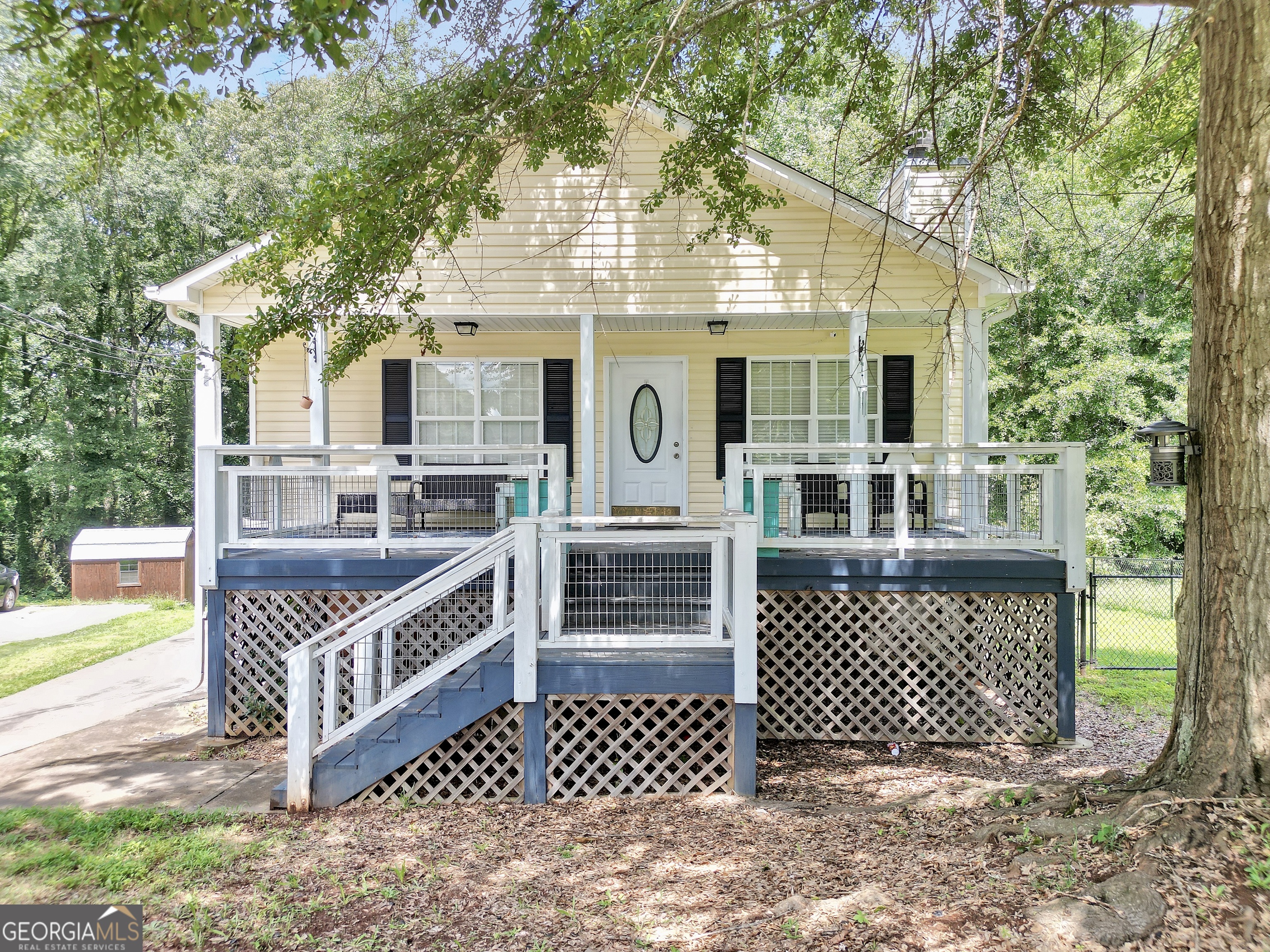 Welcome to this adorable and well-maintained 3-bedroom, 2-bath home located just minutes away from the delightful charm of downtown Monticello. Tucked away on a quiet street but just a short drive to shops and restaurants, this home offers the perfect balance of small-town convenience and comfortable living. Step inside to find a cozy and warm living space with tall ceilings, original character, and plenty of space for your growing family. The open-concept kitchen features a pantry, plenty of cabinet space and a breakfast area that's perfect for enjoying meals with friends and family. The primary suite includes a private bath and a private balcony over looking the backyard, while two additional bedrooms offer flexibility for guests, a home office, or growing families. Outside, enjoy a fenced backyard with room to garden, relax, or entertain. Home also features a basement workshop/ storage space accessible from inside the home or outside with a roll up door. Let's get you moved to Monticello!