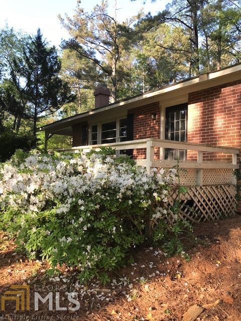 Fantastic, ready to move in 3 bedroom, 1.5 bath with wood floors, formal dining, private wooded backyard, detached workshop, Conveniently located to schools, shopping and George Pierce Park.