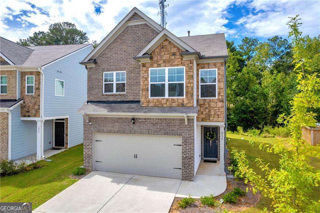 This beautifully designed, open-concept home is nestled in the desirable Bentley Ridge community, offering both style and convenience with brick and stone accents, covered front entry, and a two car garage. Located just minutes from shopping, dining, and entertainment in South Fulton, it's the perfect blend of suburban tranquility and urban access. The heart of the home is the expansive kitchen, which boasts modern stone-gray cabinets, granite countertops, sleek stainless steel appliances, a striking beveled subway tile backsplash, and a large center island that's perfect for casual dining or entertaining. A spacious walk-in pantry provides ample storage for all your culinary needs. The kitchen seamlessly flows into the family room, where you'll find a cozy fireplace, ideal for relaxing or hosting guests. The luxurious primary suite is a true retreat, featuring a tray ceiling, an oversized walk-in closet, and a spa-inspired en-suite bath. The bathroom is outfitted with dual granite vanities, a large walk-in shower, and a separate soaking tub, providing the perfect space to unwind after a long day. The home also offers generously sized secondary bedrooms, providing comfort and privacy for family or guests. The back patio and level backyard provide the perfect place for outdoor living! With its modern amenities and prime location, this home is a must-see!