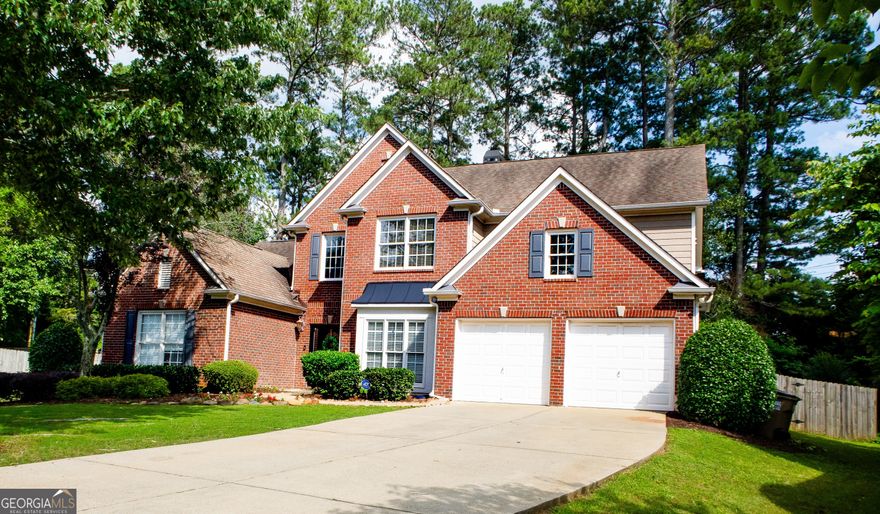 Discover the perfect blend of space, style, and location at 2720 Stillwater Lake Lane in Marietta. Tucked away on a quiet cul-de-sac in the sought-after Stillwater Lake community, this 5-bedroom, 4-bathroom home offers over 3,300 square feet of thoughtfully designed living space. The main-level owner's suite provides comfort and privacy, while the open-concept layout features a soaring two-story great room with a stunning wall of windows that floods the space with natural light and offers views of the private, fenced backyard. A double-sided fireplace connects the living area to a gourmet kitchen with a large island and double ovens-ideal for entertaining and everyday living. A second bedroom and full bath on the main floor add flexibility, while upstairs, three spacious bedrooms include a Jack-and-Jill bath and a private en-suite. Throughout, you'll find plenty of storage and little touches of character that set this home apart from cookie-cutter builds. The backyard patio offers a peaceful retreat perfect for relaxing or play. Walkable to the community pool, playground, and clubhouse, as well as nearby restaurants and schools, this home delivers the charm, convenience, and comfort you've been looking for!