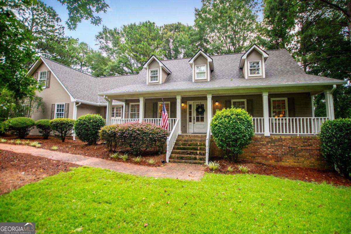 Welcome to this beautifully maintained home located in the highly desired Oak Mountain Park neighborhood , offering amenities including a pool and playground exclusively for homeowners. The inviting front porch is perfect for a swing or rocking chairs, setting the tone for the warm and cozy charm you'll find inside. The main level features new hardwood floors, a spacious great room with a cozy wood-burning fireplace, a sunroom with tiled floors , formal dining room, and a newly remodeled kitchen with quartz counter-tops , pretty cabinets, as well as new wood floors. A powder room is convenient for guests. The spacious primary suite, also located on the main level, offers privacy and convenience . Stairs from the kitchen area lead to a large bonus room complete with a half bath and would also work as a fourth bedroom. The main stairway to the 2nd floor offers bedroom 2 and 3 and a 2nd full bath. One of the bedrooms has an adjoining room great for a nursery or playroom. This home has a new roof, new gutters, is total electric and has a deck overlooking a private back yard. There is an extended driveway for extra parking and a double garage. Great storage is available in the unfinished basement area underneath the home. This is a fantastic opportunity to own a flexible, well appointed home accommodating many different life-styles at a great price in a vibrant community.