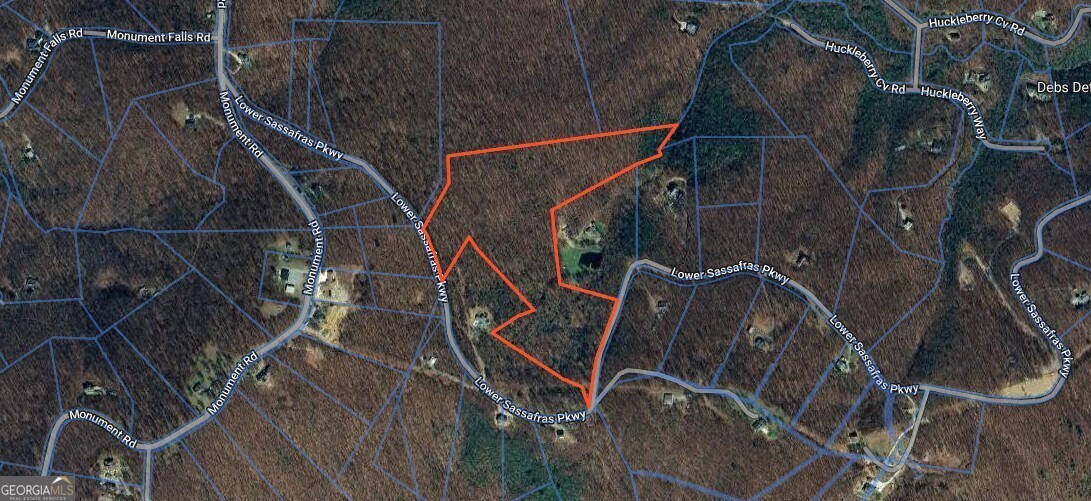 If you are looking for mountain property with a long range 180 degree view, this is it. Views Ellijay, Dahlonega,and beyond. Elevation at 2975 ft, A trail takes you from street to prime building site., Choose from several building sites. There is a natural spring that feeds a large waterfall that can be heard. Homes range from 1000 to 10000 sq ft. This is a quiet community with paved roads, close by emergency services, hiking trails, apple orchards, wineries, rafting and wildlife. 1000 Minimum Sq Ft. No Mobile Homes