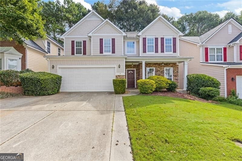 Welcome to this stunning open-concept home in a highly desired swim community. This home perfectly blends style and functionality, As you step inside, you'll love the spacious and airy feel of the home. This beautiful 4-bedroom, 2 1/2 bath layout is perfect for hosting gatherings of any size, allowing for a natural flow between the areas. The chef's kitchen has tons of cabinetry, Silestone counters and ample counter space. The large primary suite is a true sanctuary designed for ultimate comfort. Upstairs, you'll find 3 additional bedrooms and a large, cozy loft that adds an extra dimension to the home, providing a flexible space that can be used as a home office, reading nook, or additional living area. The previous owner built the enormous back deck but it can be taken down is a flat backyard is desired. Location is key, and this home delivers on convenience. Situated close to Jimmy Carter Blvd, you'll have easy access to a variety of shopping centers, dining options, and entertainment. The area is rich with amenities, ensuring that everything you need is just a short drive away. Also, the home is located in a highly regarded school district, making it an excellent choice for families seeking quality education for their children.
