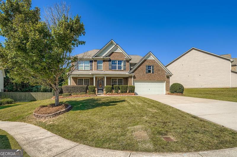 Beautiful home in the sought-after Seckinger High School District! Conveniently located near the Mall of Georgia, this entertainer's dream features a spacious island kitchen with granite countertops, tile backsplash, stainless steel appliances, and an open view to the family room. Upstairs boasts a luxurious master suite with a large walk-in closet. Enjoy great curb appeal, a prime location near shopping and dining, and top-rated schools - this home truly has it all!