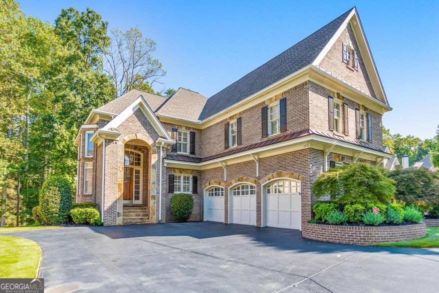 Discover the perfect family haven in a highly sought-after Marietta location! This meticulously maintained 5 bed / 4.5 bath four-sided brick and stone home sits on nearly half an acre in a quiet cul-de-sac, less than two miles from Marietta Country Club and Mount Paran Christian School. Step inside to discover a warm and inviting formal sitting and dining room, ideal for entertaining family and friends. The gourmet kitchen is a chef's delight, featuring Jenn-Air double ovens, a brand-new six-burner cooktop, a newer Bosch dishwasher, updated refrigerator, Pacific Trusteam vent hood, and granite countertops. The elegant keeping room boasts a coffered ceiling, built-in shelves, and a gas fireplace, with a bright sunroom just off the space - originally a screened-in porch that has been thoughtfully updated for year-round enjoyment. A main-level laundry room with sink, storage, and washer/dryer adds everyday convenience. Plantation shutters throughout add timeless elegance, while upgraded wrought iron spindles accent the staircase. The oversized upper-level primary suite features soaring ceilings and a sitting room with a gas fireplace. Relax in the spa-inspired primary bath that offers vaulted ceilings, two granite vanities, a jetted tub, shower, and a spacious custom closet with two separate sections. Three additional oversized bedrooms complete the upper level, with two sharing a bath offering separate vanity areas and one featuring its own ensuite. Wood floors extend throughout the main, upper, and finished basement levels, while tile flooring enhances the bathrooms. The finished basement is an entertainer's dream and includes a rec room with engineered wood flooring, a real brick accent wall, a bar with kegerator, wine fridge, and ice maker, plus a projector system with a screen and built-in entertainment center for the ultimate media room. This level also offers a full bath, bedroom/flex room, and ample storage. Step outside to enjoy the rear deck, covered lower patio with under-deck system, Zoysia lawn, and a charming pergola swing overlooking a serene wooded backdrop. Major component upgrades include upstairs/main HVAC replaced in 2020 with a warranty and Cool Air maintenance, and an ejector pump. A 4-zone sprinkler system and professional landscaping keep the grounds pristine. Additional highlights include a circular driveway, three-car garage, and a convenient path to the neighborhood tennis courts. This exceptional home combines comfort, convenience, and community, making it the perfect place to build lasting memories for years to come.