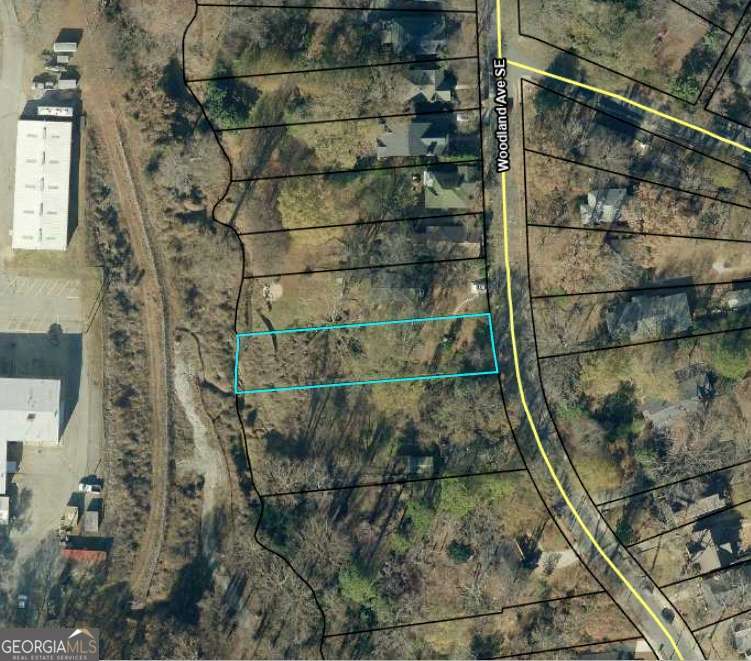 Please drive by lot to see the potential.