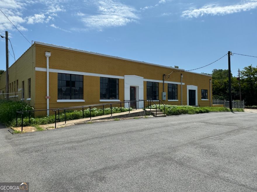 **Unlock Your Business Potential with Prime High-Visibility Properties, Priced Below Appraised Value! Appraised at $655,000, Now Priced at $639,000!**    Seller financing is available! Discover a rare opportunity to own two expansive brick-and-mortar warehouses situated on a 1.25-acre lot in a bustling area, conveniently adjacent to a thriving McDonald's restaurant and directly across from ACE Hardware.    **Building One** offers an impressive 10,186 square feet of versatile space that can accommodate a variety of business operations. This building features four large roll-up doors, three of which are electric, providing easy access for large delivery trucks and semi-trailers. Inside, you'll find a well-designed layout that includes ample office space suited for different setups, along with substantial warehouse space for storage and operational needs. For businesses that require heavy transportation, Building One is equipped with truck scales capable of handling loads up to 100,000 pounds, ensuring convenient logistics management.    **Building Two** encompasses 4,350 square feet and includes a large roll-up door for easy loading and unloading. Additionally, the rear of the building offers direct access to a railroad, providing a valuable option for businesses that rely on rail transport. Previously used as a dairy facility, this building presents a blank canvas for various business ventures.    Both buildings have undergone significant upgrades to enhance functionality and aesthetic appeal. A new chain-link safety fence has been installed around the perimeter, ensuring secure access. The exterior has received a complete paint job, revitalizing its appearance. Modern glass windows have been added to improve natural light, while elegant new wood floors create a welcoming environment. Updated lighting fixtures enhance energy efficiency and aesthetics, and the front parking lot has been freshly paved and striped, providing ample parking space for customers and employees.    With abundant office space in both buildings, you have the flexibility to explore a diverse range of business opportunities. Imagine transforming the property into a dynamic indoor sports complex suitable for activities like basketball or golf simulation, an exciting arcade that engages patrons of all ages, or even a unique brewery/tap room that attracts the local community. The potential uses for this prime property are limitless!    Positioned in a high-traffic area with no comparable properties nearby, this is the perfect moment to expand or launch your business in this exceptional location. Don't let this opportunity pass you by. Contact me today to discuss the incredible possibilities that await you!