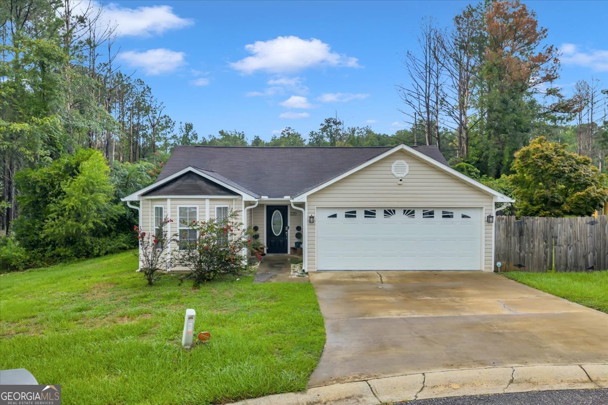 Charming ranch home tucked away at the end of a cul-de-sac! This open, split floor plan offers 3 bedrooms, 2 baths, and a versatile bonus room. The kitchen features a great layout with a breakfast bar, perfect for casual meals. The spacious great room boasts a cozy fireplace with electric logs, while the owner's suite impresses with a tray ceiling, two walk-in closets, and a bath with a large soaking tub and separate shower. The bonus room works beautifully as a home office or hobby space. Outdoors, the patio is ideal for grilling, entertaining, or enjoying your morning coffee.