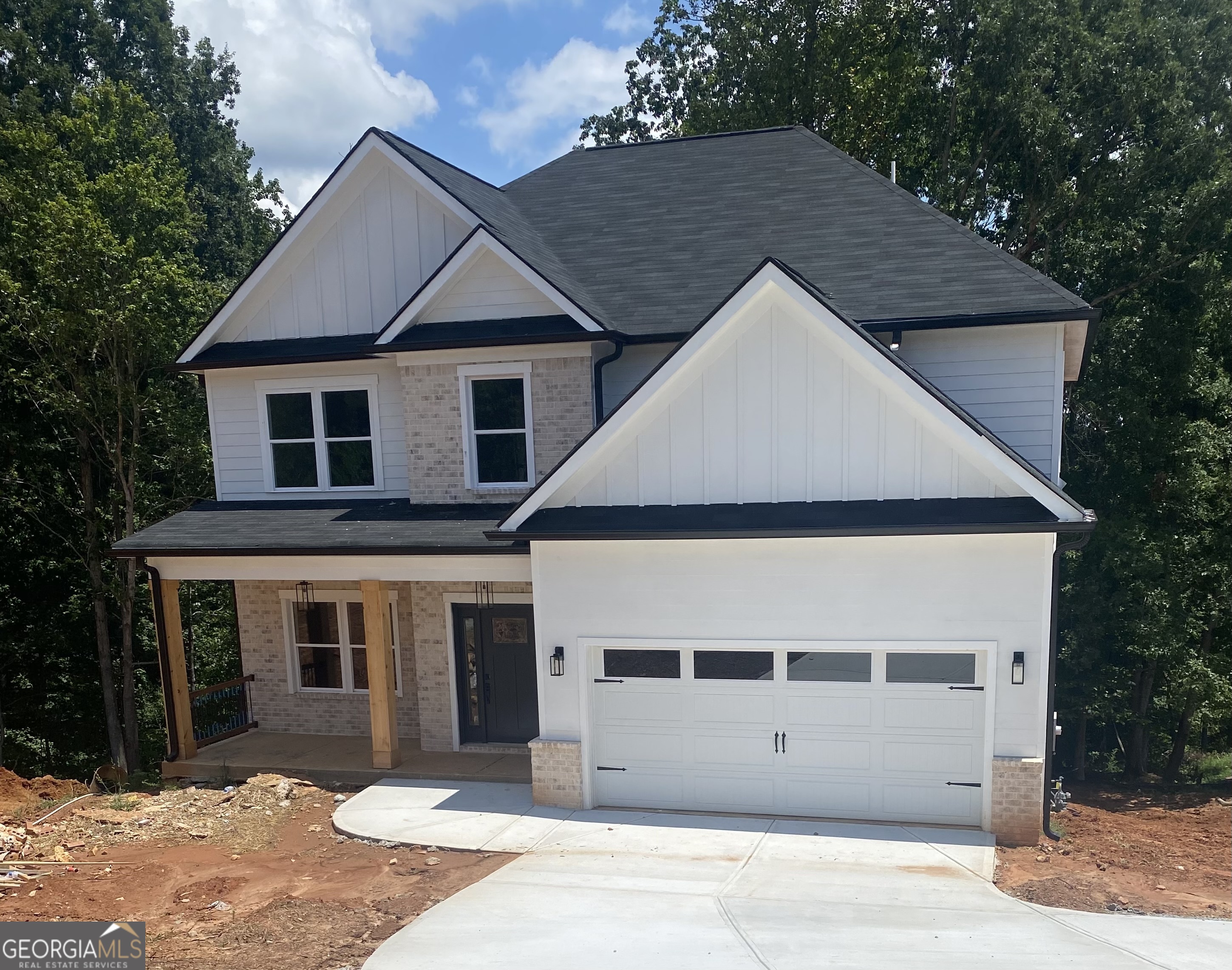 Fabulous new build on one acre lot in booming Flowery Branch! Very open two story floor plan features 4 bdrm/4 and a half bath, on a full finished basement with a covered back porch and outdoor fireplace. You cannot beat this location! The best schools, a gorgeous Lot with NO HOA, a quiet street, and yet you can practically walk to all the shopping and restaurants right there at Spout Springs Rd off of I985. And very close to Lake Lanier and the quaint little downtown area of Flowery Branch. This home boasts finishes found in much higher end homes. Home is near completion. Working on finishing touches, final paint, hardscape and Landscape.