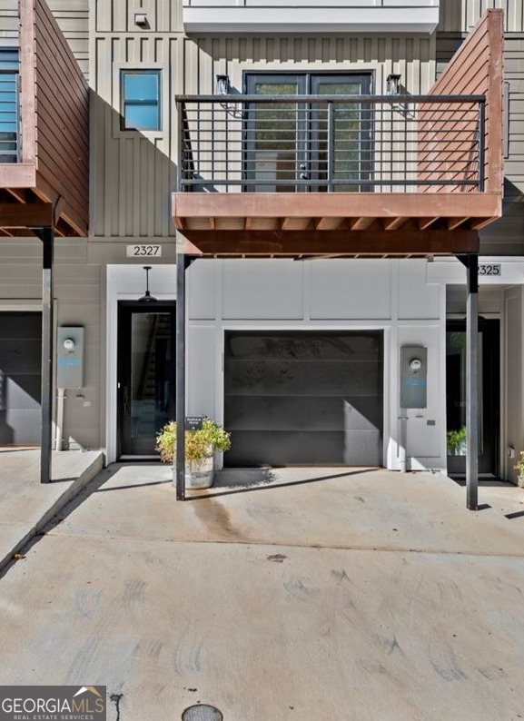 Welcome home to Mason Flats, a gated enclave of luxury townhomes in East Atlanta! 2327 Mason Drive is a stunning unit offering 3 bedrooms, 3.5 baths, versatile flex space, and 1981 heated square feet. Part of an intimate community of 37 boutique-style townhomes, this unit is move-in ready and perfect for modern living! Step inside to a light-filled, open-concept design with wide plank hardwood floors, 10 ft ceilings, and 8 ft doors. The chef-inspired kitchen features shaker-style cabinets, quartz countertops, an oversized island, and state-of-the-art stainless steel JennAir Pro-Style Rise appliances including a gas range and French door refrigerator. Enjoy three outdoor living spacesCoa front streetside deck, a 12x16-foot tree-top deck at the rear, and a private terrace patio. Upstairs, the primary suite boasts natural light, a trey ceiling, barn doors, plush carpeting, and a spa-like bath with designer finishes. The secondary bedroom offers an ensuite bath and ample light. The lower levels feature a loft-like flex room, a third bedroom with ensuite bath, and a private patio ... perfect space for a home office, media room, or guest space. There are no CstandardC builder packages in this boutique community of luxury townhomes. While the floor plans of each home are similar, the finishes in each flat have been designer curated so each home is one of a kind. The unique features in this home include: light-toned 5" plank hardwood flooring on the main floor & upstairs hallway; 8 ft Full Light French doors leading to the tree top deck; A built-in banquette in the dining room; a chef's kitchen featuring gray perimeter cabinets and a white island topped with white quartz tops finished with a gray vertically stacked tile backsplash and designer curated lighting adding a sleek feel to the space; and, an edgy black and white primary bath with geometric patterned tile adding an element of fun to the primary suite. Additional features include a single-car garage prewired for electric vehicles and extra driveway parking. Mason Flats is a gated community with a firepit and green space, just 2 miles from vibrant East Atlanta Village with shops, restaurants, and nightlife. Easy interstate access makes commuting a breeze. 5.75% interest rate on a 30-year fixed loan are available with our preferred lender. Only six opportunities remain in Phase 3. Make an appointment today or visit our model home. We cannot wait to welcome you to Mason Flats!