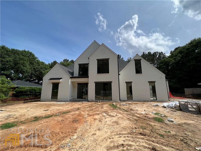 Introducing an amazing Rosen Custom Home New build in a Primary Downtown Alpharetta neighborhood with a pool. 4 sided painted brick home offers tons of natural light through the large metal windows and doors. Ultra fine finishes throughout including custom cabinetry, quartz counters, wolf/sub-zero appliances, marble primary suite bath w/heated floors, hardwoods throughout, large enclosed loggia w/fireplace and auto screen all overlooking the heated saltwater pool/spa and level fenced backyard for year-round privacy and entertaining. Don't miss out on this beautiful build just steps to everything downtown Alpharetta has to offer.