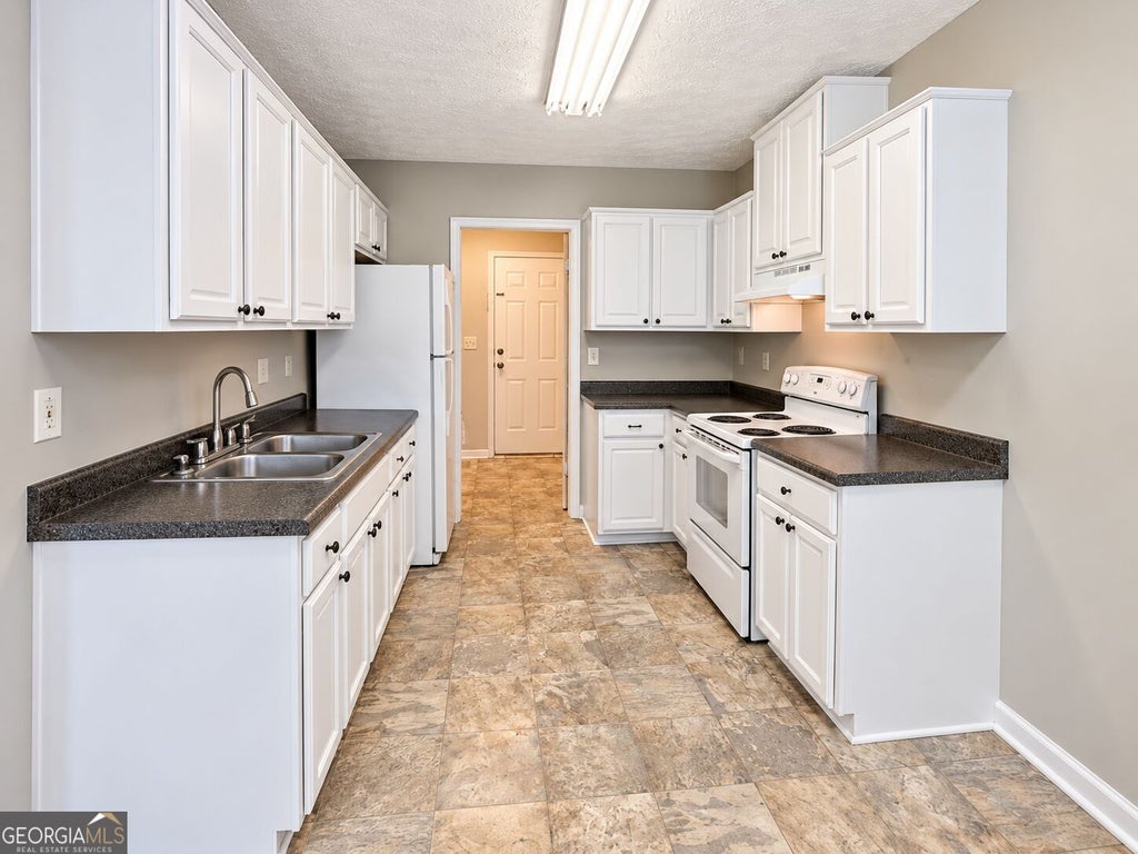 Photo of 310 Freeport Drive, Lawrenceville, GA 30046 (MLS # 10842996)