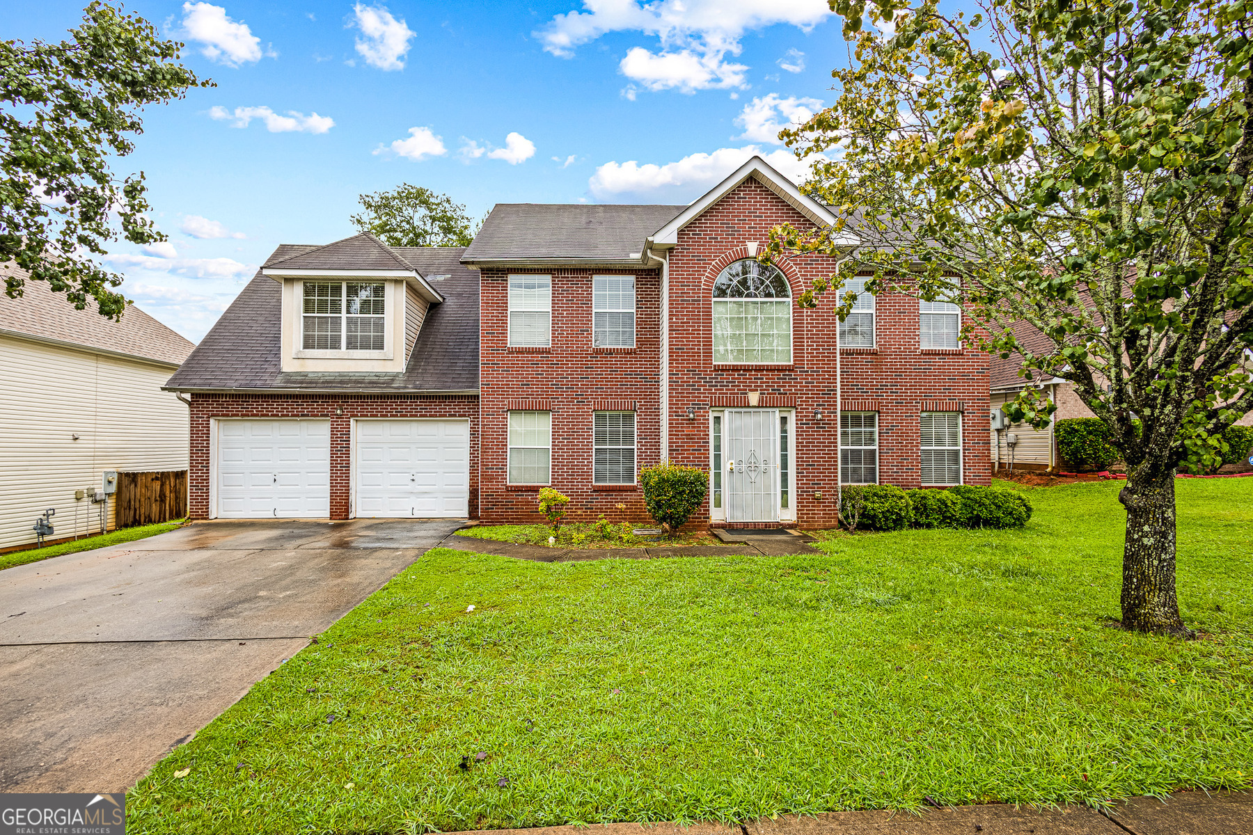 This home has been priced to reflect no recent updates, which makes it perfect for the buyer looking to put their own unique design touch into action. Nestled in the family-friendly neighborhood of The Manor subdivision in Jonesboro, this traditional 2-story brick-front home offers spacious, well-planned living. Built in 2005, it provides ample front and backyard. This home has a classic architectural/traditional style. Front foyer welcomes guests into a two-story entry with a dining room and flexible living/office space. The great room features a cozy fireplace with a seamless flow into the kitchen. The kitchen is equipped with ample cabinetry, breakfast area, and sight lines into the family room. There are four (4) sizable bedrooms upstairs, including a spacious primary suite. Suitable for those working in Atlanta but preferring suburban comfort with easy access to I-75. As evidenced by the pictures, packing has already begun. All reasonable offers will be considered.