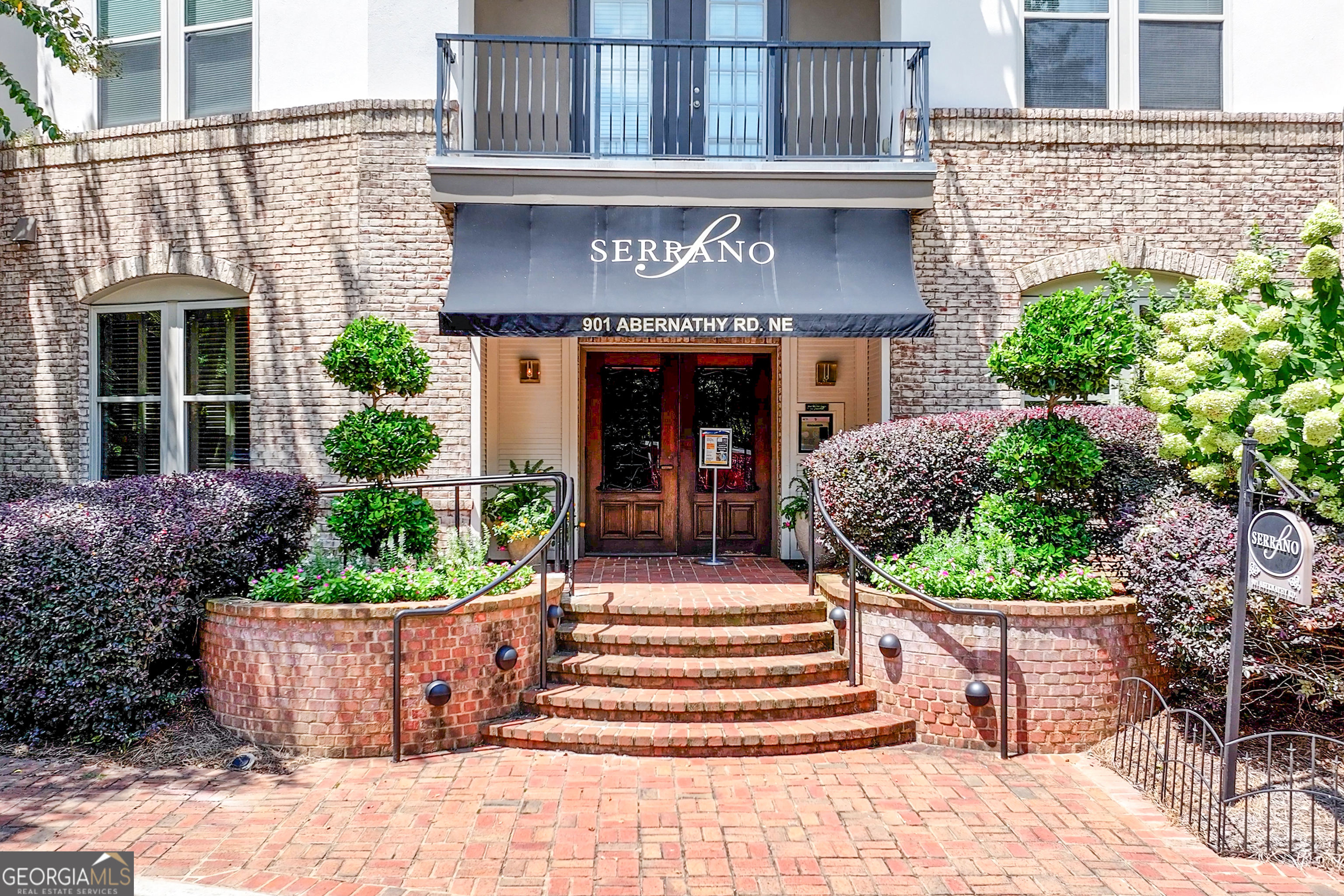 Don't miss this rare opportunity! MOVE-IN-READY, pet-friendly, and highly sought-after, this Sandy Springs gem delivers comfort, convenience, and lifestyle. Step into this open layout with gleaming solid stone counters and stainless-steel Whirlpool appliances-perfect for effortless living and entertaining. Start your mornings with ease thanks to full-size in unit laundry and a dreamy primary suite with a sliding barn door featuring a spa-like oversized shower with dual shower heads and a professionally designed, custom closet system-a thoughtfully crafted space that transforms daily routines into moments of calm, with room for everything and style to spare. The versatile second bedroom-with its walk-through closet-makes an ideal guest retreat, home office, or flex space. Unwind on your private patio oasis, then explore amenities designed to elevate every day: 24/7 fitness center, sauna, pool, grilling area, club room, movie theater, and concierge. Enjoy the luxury of rare, large private storage, and assigned covered parking. BUYERS WILL LOVE the lush hydrangea blooms just outside-so gorgeous you can see, smell, and touch them like a luxury wedding backdrop. Fall in love with the peaceful walking trails and shaded picnic-perfect settings at the nearby park-ideal for Sunday strolls or quiet moments. Walk to favorite hidden gems, MARTA and access highways, Perimeter Mall, multiple shopping centers, Whole Foods, Target, super fun immersive experiences and top-rated international dining Oh My! Zoned to highly coveted top-ranked schools. This is more than a condo-it's a vibe, a LIFESTYLE! This kind of UPDATED unit rarely becomes available. ACT FAST-expected to be gone fast. SCHEDULE your private showing of the perfect HOME for YOU today! Make sure you see the VIDEO! Patio staged.