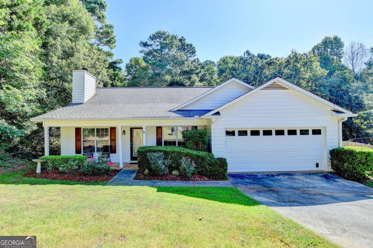 Spacious 3BR/2BA ranch on an over 1 acre lot. NO HOA. Wide open family room with cozy wood burning fireplace. Separate dining room. Kitchen overlooks the family room and includes stainless steel appliances, a breakfast area, pantry, and lots of cabinets for storage. Primary suite on the main level with trey ceiling and private spa bath with garden tub and separate shower. Generous secondary bedrooms. Covered back patio that is great for entertaining or relaxing. Private, fenced-in backyard backs up to a peaceful wooded setting. Just minutes from downtown Winder or Highway 8. Easy access to Bethlehem, Athens, and Highway 316. Shopping, restaurants, and parks nearby.