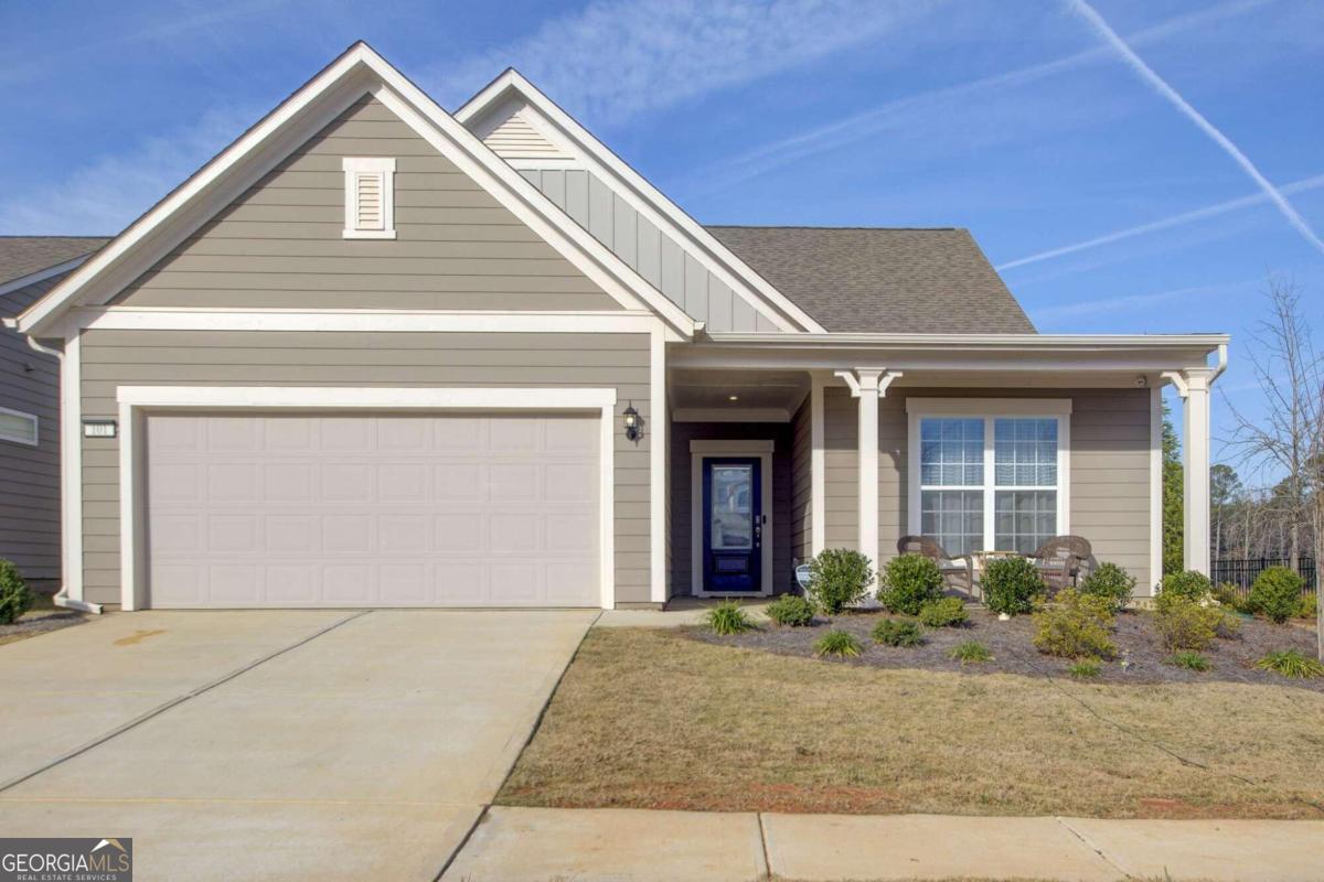 Welcome home to the illustrious and highly coveted neighborhood of Sun City Peachtree! This 55+ golf community has more amenities than you can count. The neighborhood features an immaculate golf course, indoor and outdoor pool, fully equipped gym, theater room, clubhouse, "grandkids" playground, dog park, pool tables, pickle ball courts and more! Built in 2021 on a premium corner lot, this home has all the upgrades you could want in a new build without the wait or extra surcharge. The Master suite is conveniently located on the main floor featuring tray ceilings with crown molding, upgraded bathroom equipped with a garden tub, extra large shower, ceramic walls and premium tile flooring. The open concept kitchen features granite countertops, stainless steel appliances, walk-in pantry, and features upgrades such as soft-close cabinets with under-cabinet lighting, roll-out cabinet shelves, garbage disposal, and a 36" gas cooktop with grill. With 3 bedrooms and 2 full bathrooms located on the main floor you will find this house more than enough utility. An additional bedroom, bathroom, extra large loft area and large walk-in attic storage space all located upstairs, this home's flexibility and functionality is on another level compared to its neighborhood counterparts. Perfect for a larger family. Outside you have a covered porch area in the front and a covered patio area in the back equipped with a gas hookup to facilitate all your grilling needs. Additional features include garage extension of 4 ft, mud area at garage entrance, upgraded window trim and apron throughout, upgraded light fixtures, 42" wiring center with power module, touchscreen keypad located at front door, multiple (6) 110 vault smart tubes with power outlets, Allen and Roth cordless blinds throughout and more! Priced to Sell, you have to come see this one for yourself!