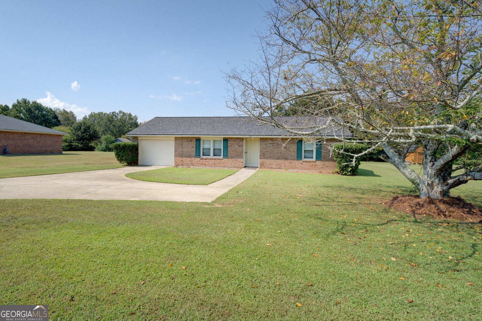 Adorable 2BR/1BA Four-Sided Brick Ranch with New Roof! Welcome home to this charming two-bedroom, one-bath brick ranch, nestled on nearly half an acre of flat, usable land-perfect for a garden, play space, or fenced-in yard for your furry companions! Inside, you'll love the open-concept living and kitchen area, ideal for entertaining. Pull up a bar stool at the counter and chat with the cook, or relax in the living space while staying connected to the heart of the home. The spacious primary bedroom connects directly to the oversized bathroom, which features a large linen closet and beautifully preserved original tile flooring. The second bedroom offers convenient hall access to the same bathroom-great for guests or roommates. Step out onto the back patio and enjoy your private outdoor space. The attached one-car garage includes a generous storage room, giving you even more room to stay organized. Additional highlights include:New roof (recently installed), New luxury vinyl plank (LVP) flooring throughout (2022) ,New dishwasher (2024) Located just minutes from downtown Conyers, GA, you'll enjoy easy access to local dining, shopping, theater, and more. Plus, I-20 is just around the corner-making commuting a breeze and getting to the airport quick and convenient. Don't miss this cute, move-in-ready gem-it's the perfect blend of cozy charm and modern updates!