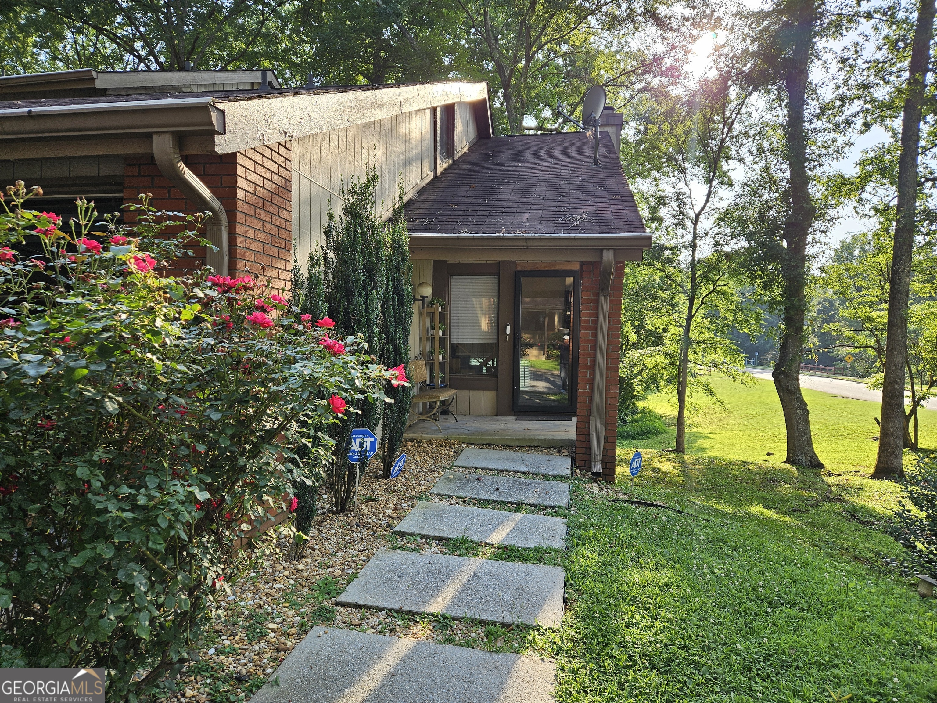 2-bedroom Townhome with a loft situated in the Mainstreet subdivision of Stone Mountain. This is a great end unit with a 2-car attached garage. Update with just a few finishing touches to make it your home! Great for a first-time buyer. Low HOA dues that include water, sewer, trash and no rent restrictions!