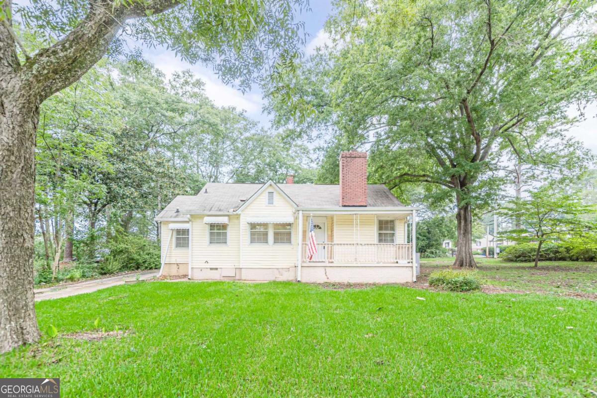Adorable starter home or investment property with easy access to downtown restaurants, Lagrange High School, and the thread trail. Original, refinished hardwood floors in family room and bedrooms. Separate dining room next to the quaint kitchen with painted cabinets, new appliances, and granite countertops. An additional large flex room perfect for a third bedroom or more living space with an attached full bathroom! Home to be sold AS-IS, brand new water heater (2025) and newer HVAC system (2022)!