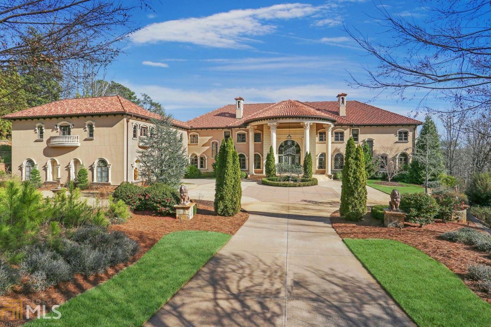 Expansive, luxury Mediterranean estate on 3.4+/- acres. You are welcomed to this 26,000+/- home by 18-foot iron front doors which lead to the stunning two-story foyer and double staircase. The home features 8 bedrooms, 8 full- and 4 half-bathrooms, gourmet kitchen, two-level, paneled library, master suite on main, terrace level complete with bar, custom media room, wine cellar, cigar room, elevator, 8-car garage and large in-law suite with separate entrance. The outdoors will impress you with total privacy, a stunning skyline view of the city, heated saltwater pool and spa and putting green. The home also features Creston lighting control, security system, cameras and a whole house generator.