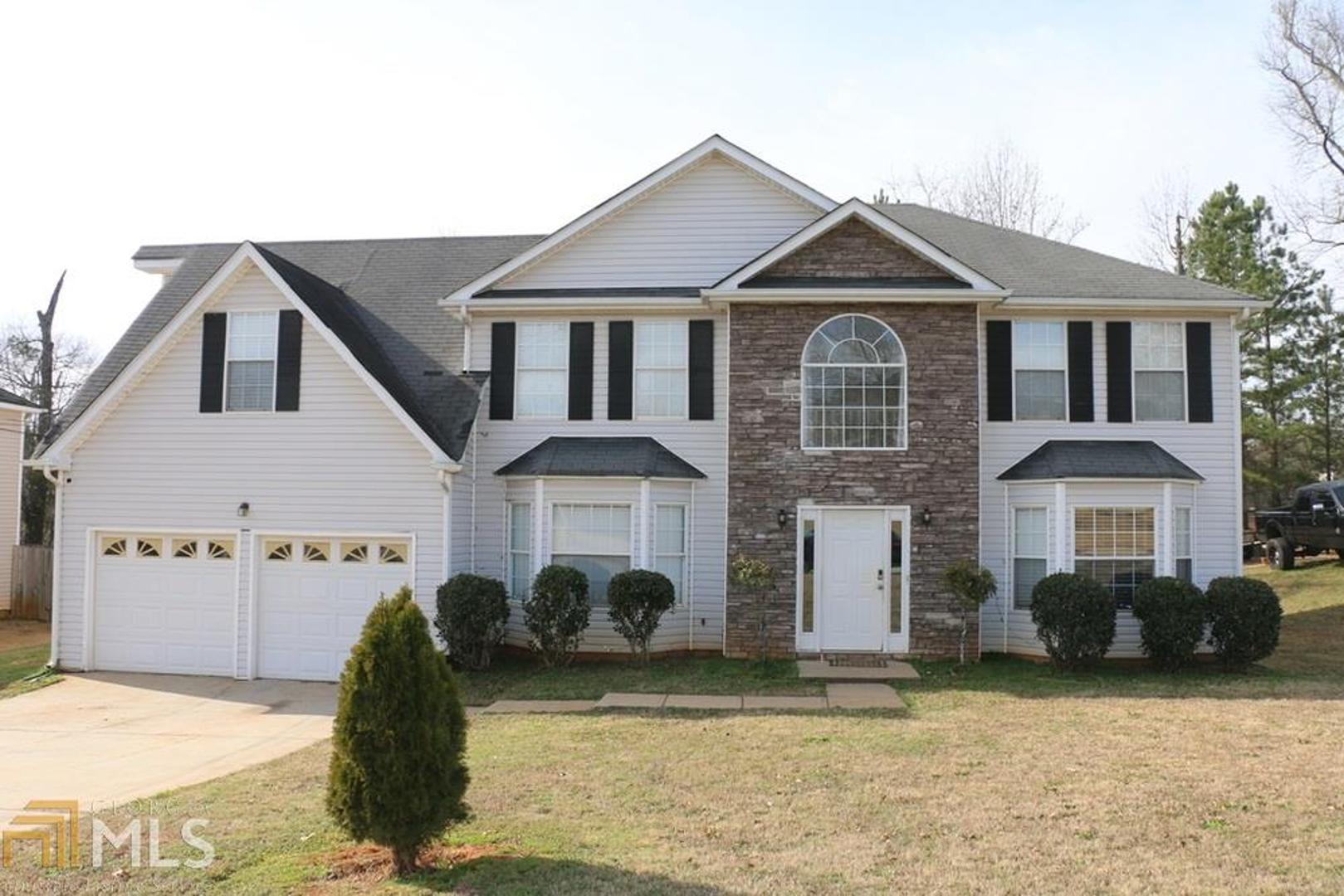 Beautiful & Spacious 2-story Home. Features Hardwood Floors throughout out. Kitchen has tile floors and opens to sunken fireside family room. Front & Back Staircase. Separate Dining & Living Room. Guest bedroom on Main Level. Large secondary Bedrooms includes an oversized room with a Fireplace that can be a 2nd master suite. Large & Level Fenced Yard. Great location within walking distance to shopping & Marta. Minutes from 285.