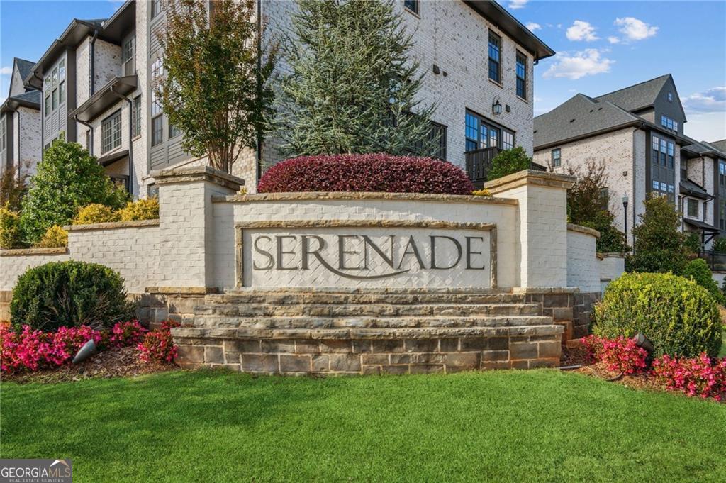|| GATED COMMUNITY || || IN-GROUND SWIMMING POOL & CLUBHOUSE || || ACROSS FROM AMERIS BANK AMPHITHEATRE || || 2 MILES TO AVALON & DOWNTOWN ALPHARETTA || || PET FRIENDLY & WALKABLE || CAN BE SOLD FURNISHED - OVER $5K WORTH OF FURNITURE LESS THAN TWO YEARS OLD || IMPECCABLE HOA CLEANING SERVICE FOR COMMON AREA || ** What You'll See ** Step inside and take in the sleek, MODERN DESIGN, with clean architectural lines, elegant lighting fixtures, and a gleaming KITCHEN ISLAND that centers the OPEN-CONCEPT living space. You'll notice how NEW everything feels-because it is. From STATE-OF-THE-ART APPLIANCES to beautiful floors, the attention to detail is everywhere. Step outside your door and you're surrounded by lush, professionally landscaped greenery, a SPARKLING COMMUNITY POOL, and lighted walking paths in ENCORE PARK. You'll see friendly neighbors out walking dogs, enjoying the quiet, safe environment that makes Serenade such a gem. ** What You'll Hear ** Hear the laughter from the CLUBHOUSE during weekend socials or the distant melodies floating in from the AMERIS BANK AMPHITHEATRE across the street-your own private soundtrack to summer evenings. Inside, peace and quiet reign thanks to solid construction and careful community upkeep. Morning birdsong mixes with the soft whir of your modern appliances, creating a calm, comforting soundscape you'll love waking up to. ** What You'll Feel ** From the moment you step through the gate, you'll feel SECURE, welcomed, and at ease. The pet-friendly environment adds warmth, and the well-maintained grounds and friendly neighbors create a sense of belonging. In your home, the natural flow of the layout is open yet cozy. Whether you're relaxing by the pool or prepping dinner on your oversized island, you'll feel connected to your surroundings, yet free to unwind. ** What You'll Experience ** Every day here is about CONVENIENCE and LIFESTYLE. You're just minutes from the shops and restaurants of AVALON and downtown Alpharetta, with Roswell and Topgolf close by too. The GA-400 access puts all of Atlanta at your fingertips. Love music? Catch a show across the street. Love your pup? Walk next door to FETCH DOG PARK. This home isn't just a condo-it's your gateway to a vibrant, balanced, connected life. HOA dues are paid monthly at $460.
