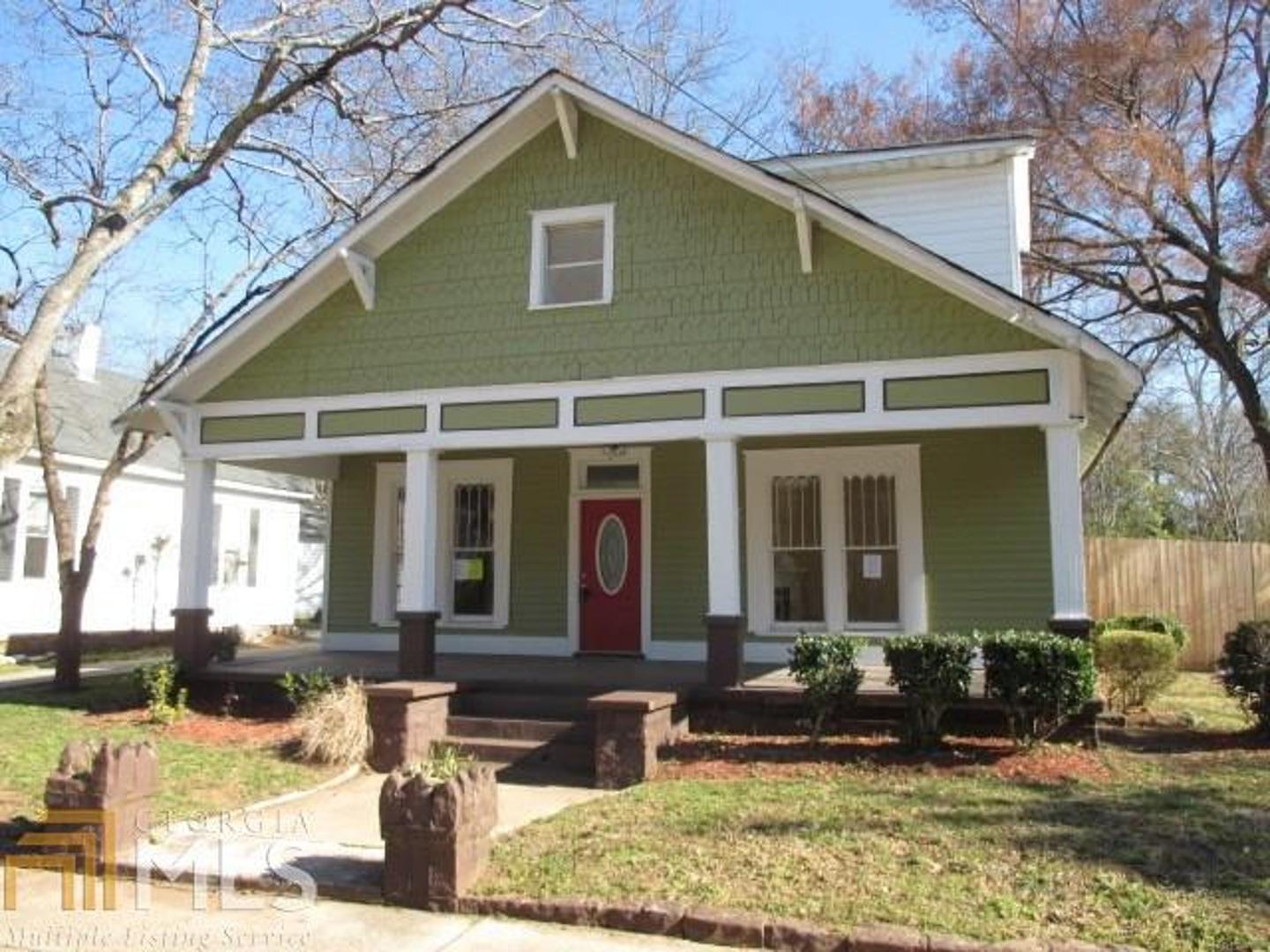 Amazing historical home with renovations already started. Nice tile in bathrooms & kitchen, tons of hardwood floors, upgraded light fixtures, several fireplaces, & lots of charm & character. Home offers an incredible 7 bedrooms & 4 bathrooms! So much space & so much potential here! Wonderful rocking chair front porch, spacious deck, great fenced-in backyard, & a basketball court! Incredible price for this historical 1900 home. Don't miss it!