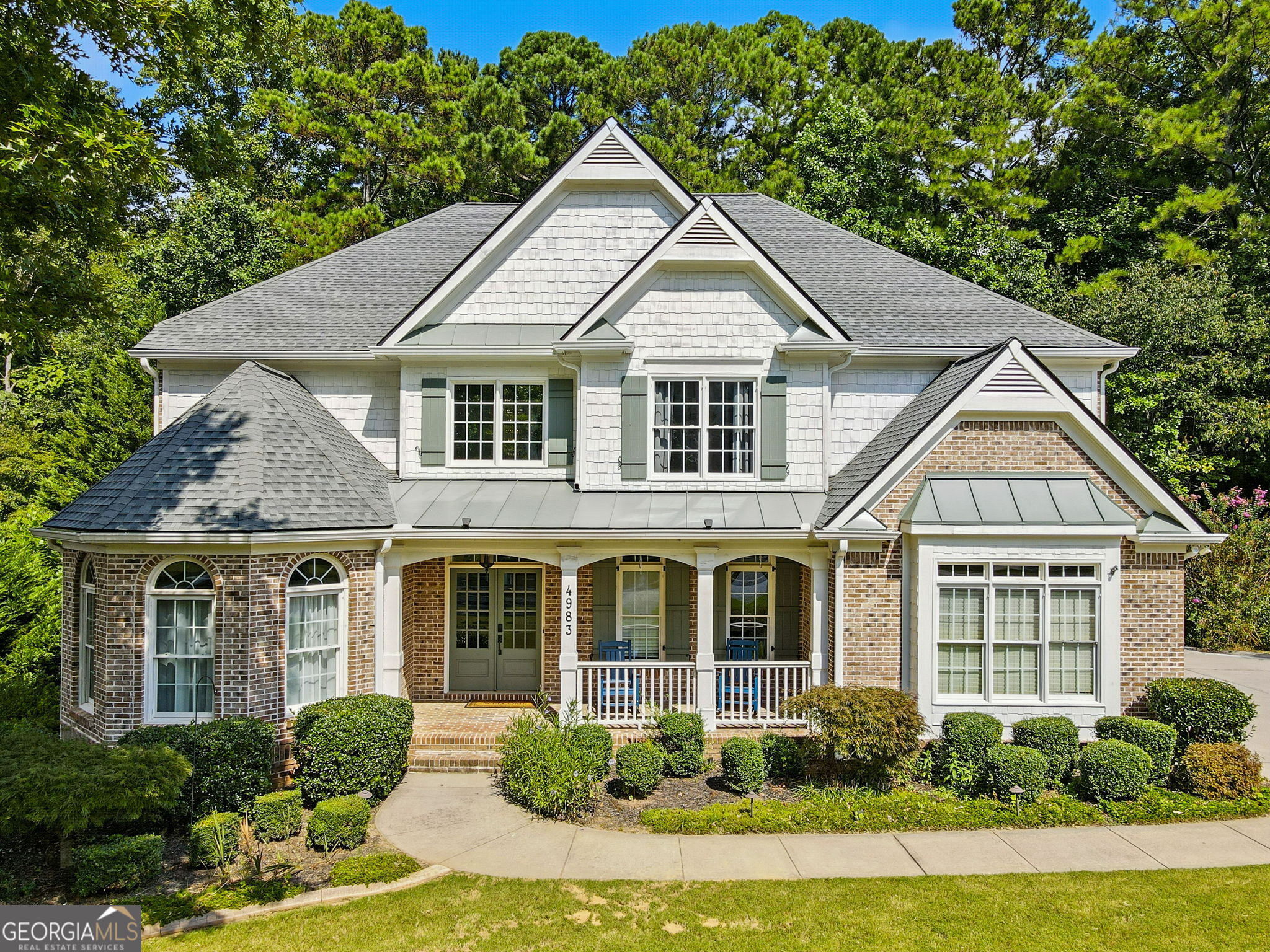 Beautiful Executive Home with private backyard that backs up to Green Space with a small crick. This beautiful home is the perfect setting starting with the warm inviting front porch that's brick laid. A two story foyer makes an impressive entrance along with the detailed trim work and showing off the recent refinished hardwood flooring throughout the main level. Front sitting room with bay windows over looking the oversized dining room. The large family room offers a gas fireplace and coffered ceiling overlooking the private wooded backyard. The kitchen is a culinary dream with walk-in pantry, ss GE double ovens, microwave, gas cooktop and under counter lighting. There is a bedroom off the kitchen that could be turned into a private office for the work from home professional or a quiet playroom for the children with a quick close the door clean! The second floor offers and over sized primary suite with sitting area and primary bathroom with double vanities, tiled walk-in shower with double heads, and his and her closets. The secondary bedrooms are more than spacious with walk-in closets. Let's not forget the incredible bonus room with fireplace on the second floor too great for the kids and gaming. The second floor has all brand new higher end carpet as it should. The finished basement is just another amazing feature of this home offering an LVP flooring with a mini kitchenette, a bedroom and full bath. Three amazingly large rooms for extra TV football nights, pool table and ping pong rooms or possible crafting or really large workout room. Could even be a GREAT in-law suite. Walk out onto the back patio and enjoy the stone fireplace that overlooks your wooded backyard. You won't be disappointed. The roof is approx 5 years old, a brand new hot water heater and new in 2022 was HVAC for second story.