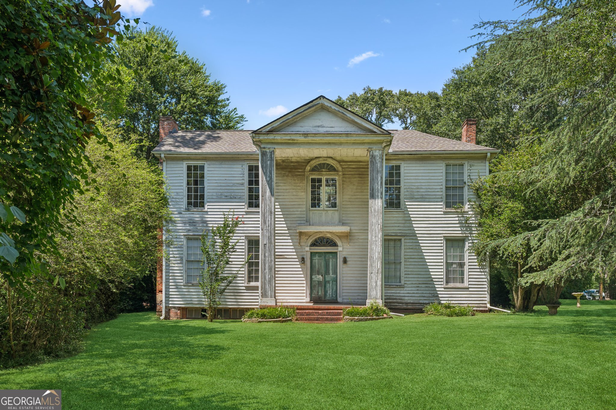 Circa 1838 Historic Masterpiece - Rare Restoration Opportunity! The Capers/Dickson/Branham House is calling. A stunning example of Southern Federal elegance, this architectural jewel offers a once-in-a-lifetime chance to breathe new life into a piece of history. Featuring a classic two-story portico, fan-lighted doors with original pilasters, and six fireplaces-including a jaw-dropping Adams-style triple sunburst mantle with bamboo-style columns-this is the kind of character you can't recreate. Original heart pine floors run throughout, and remnants of early wallpaper still grace the walls. The roof is relatively new, the structure is rock solid, and the home is just waiting for HVAC and your vision to revive its full glory. This is not a project for the casual hobbyist-but for the serious restorer or savvy investor, it's a dream ready to be realized. Whether you see a luxury forever home or a high-end flip, the potential is staggering. Act fast-properties like this don't wait. And neither should you.
