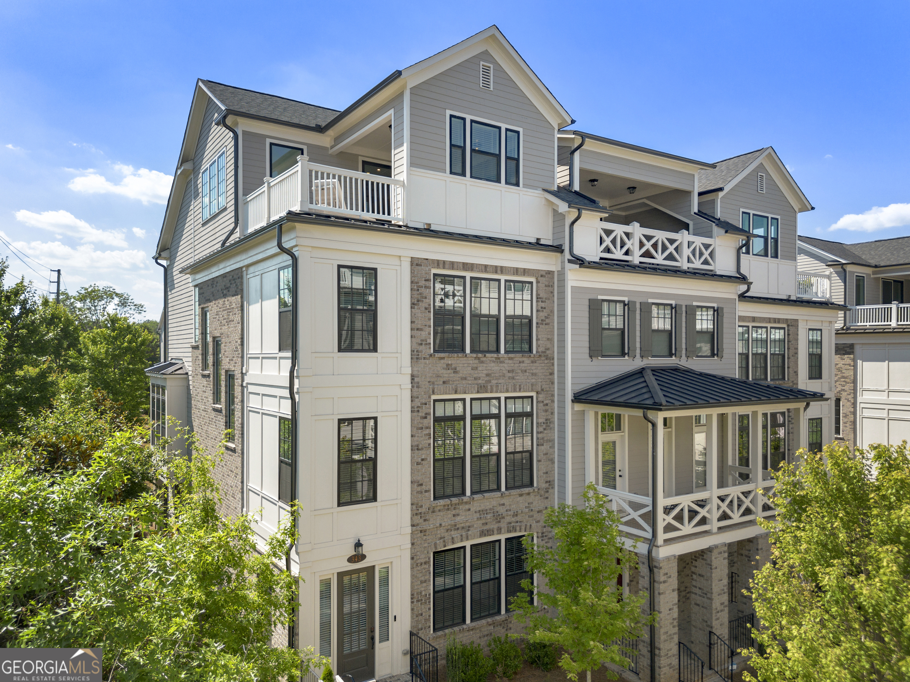 LOWEST PRICE PER SQ FOOT AT FOUNDRY! LARGEST UNIT IN FOUNDRY. ELEVATOR AND ROOFTOP! MOTIVATED SELLER. This stunning 4-story townhome in the heart of Alpharetta offers the perfect blend of style and convenience, just steps from Avalon and the Alpha Loop. Inside, an open floor plan showcases custom cabinetry, designer lighting, and wide-plank hardwoods. The chefCOs kitchen stuns with a quartz waterfall island, stainless steel appliances, and a sunlit breakfast nook leading to a grilling deck. A cozy fireside living area and elegant dining space complete the main level. The third-floor primary suite is a serene retreat with a spa-like bath and walk-in closets, alongside a guest suite and laundry room. Upstairs, a sky terrace and covered patio provide the ultimate indoor-outdoor escape. A two-car garage, mudroom, and versatile lower-level spaceCoperfect for a gym, office, or extra bedroomCoadd function to the style. With a community pool for added leisure, this home is the epitome of upscale living.