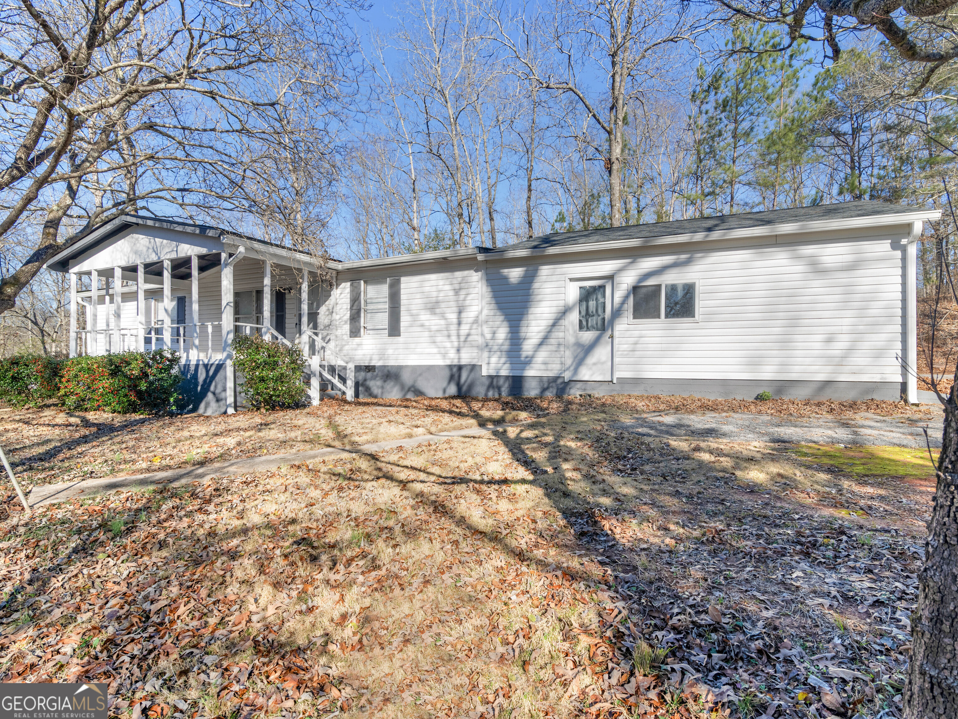 Sportsman's Paradise!! Nestled in a stunning natural setting, the 10.64-acre property is surrounded by majestic hardwood trees and the serene Potato Creek, offering the perfect environment for hunting, fishing, and outdoor recreation. Recent updates make this home feel brand new, with a newly installed roof and gutters, flooring throughout, and a beautifully renovated kitchen. Additional upgrades include new toilets, vanities, light fixtures, a new AC unit, and fresh paint, ensuring a modern and comfortable living experience. This property is located within the highly regarded Lamar County Public School District, providing excellent educational opportunities. Don't miss the chance to see this incredible property for yourself! Schedule a viewing through ShowingTime. Agent Owned
