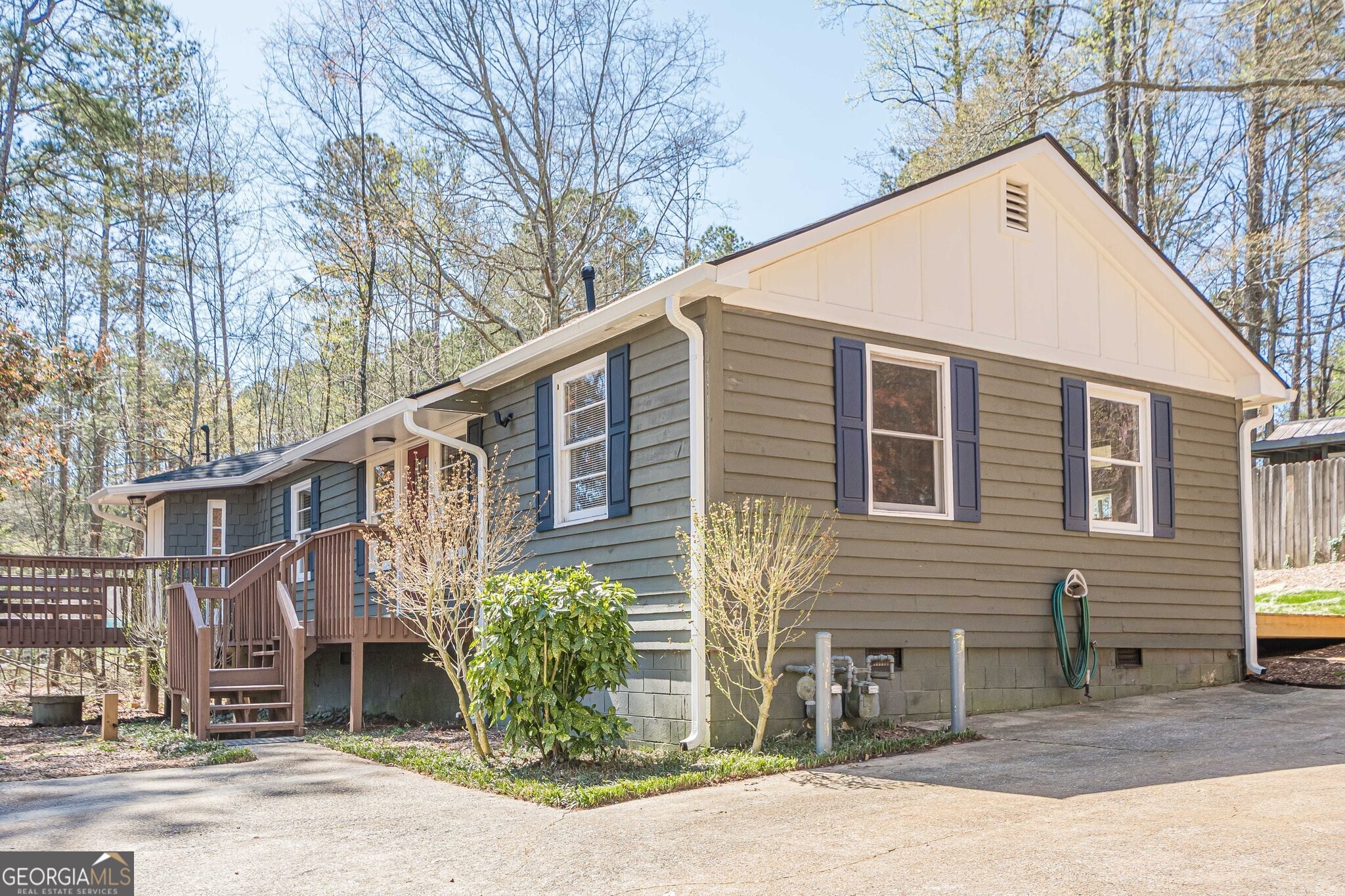 Welcome to your private retreat, just minutes from the heart of Woodstock! Set back from the road on almost an acre of usable land with secondary structure behind this charming ranch house which has been completely gutted and remodeled. It offers a rare blend of space, privacy and flexibility. Inside the main house you will find a bright, open layout with new LVP flooring and spacious living. The updated kitchen includes new appliances, generous counter space with a view to the family room. NO HOA means peaceful, flexible living!