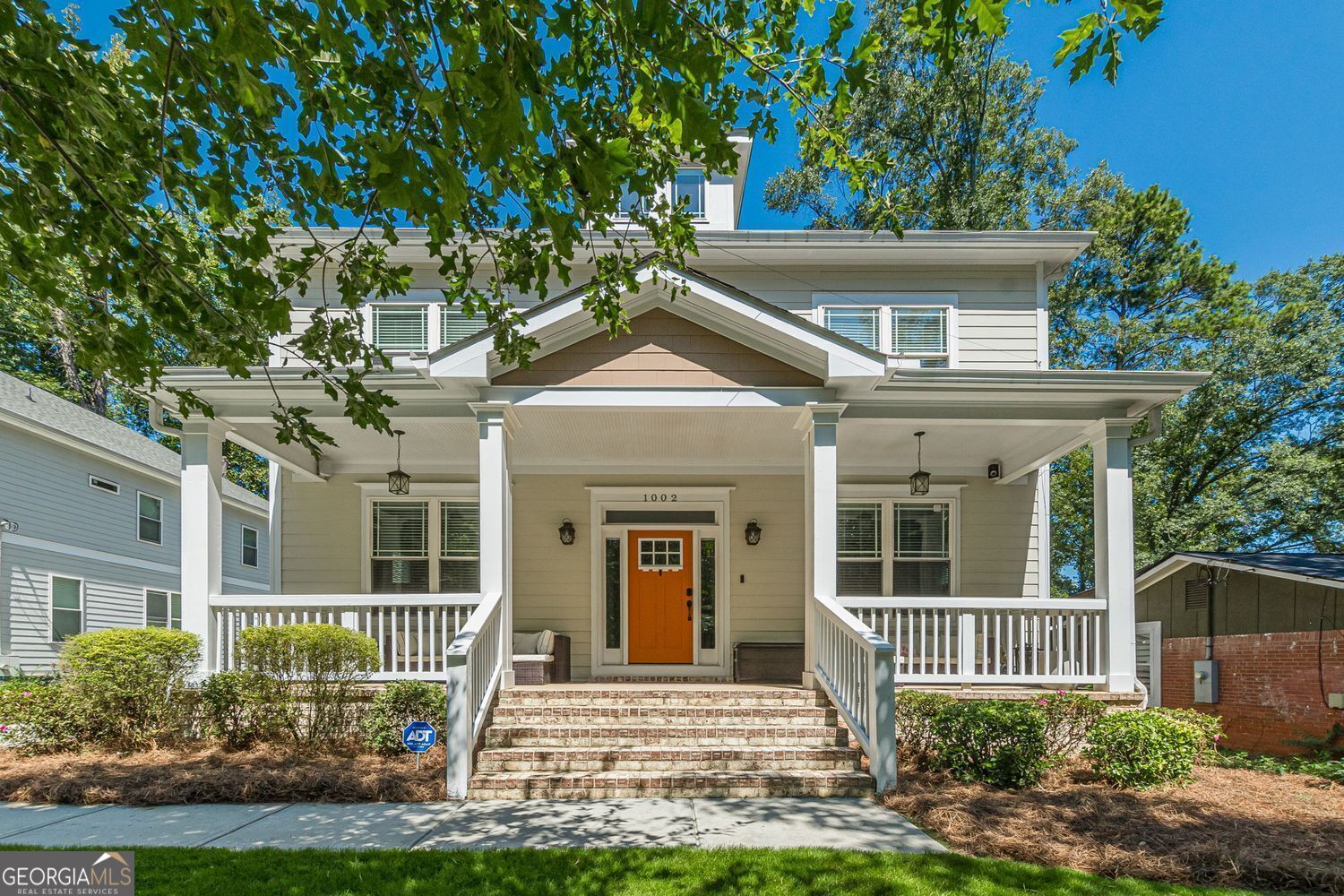 Perched on a hill, ascend to this charming spacious craftsman home as the expansive rocking chair front porch instantly transforms you into RELAX mode. Enter through the long wide corridor with gleaming hardwood floors that span the entire main level, with 10' ceilings and heavy crown molding that add a touch of sophistication. The warm neutral color palette highlights the incredible millwork detail that craftsman homes are known for. Adding to the character of this LOVELY home are timeless features that include coffered ceilings, French doors, and a beautiful fireplace surrounded by custom wall-to-wall shelving. The butler's pantry provides a sense of separation between the kitchen and large dining room. The open concept eat-in kitchen is equipped with SS appliances, all white cabinets, center island, and granite countertops, plus double door that access the open-air rear deck. The kitchen also opens to the LARGE living room that features another set of double doors leading to a screened porch + the open-air deck, while overlooking the back yard. This home also has a highly desirable main-level bedroom currently used as an office within close proximity to a full bath. The temperature is moderated via dual-zone climate control thermostats. Upstairs, you will find 3 sizeable secondary bedrooms, 2 separated by a Jack & Jill bathroom, and a 3rd bedroom with a private ensuite bath. Additionally, escape to the Owner's Suite, a MASSIVE oasis right at home, flanked by a beautiful 5-piece master bath with a double vanity, soaking tub, with separate shower on one side, plus an EXPANSIVE walk-in closet with endless storage on the other side. If you need more living space, the large unfinished plumbed & studded basement offers many options to grow, while the spacious detached 2-car garage secures your vehicles & protects them from the elements. This home is perfectly situated between Grant Park, Ormewood Park, and near East Atlanta Village, plus The Beltline.