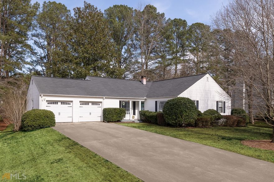 Perfect cape cod style ranch in the East Cobb community of Willow Ridge. Updated kitchen and baths, gleaming hardwood floors, neutral on-trend paint, newer light fixtures & a huge backyard - this home checks all the boxes! Covered front porch for perfect curb appeal. Large, welcoming foyer open to the living room. Dining room with custom barn doors. Fireside family room off the breakfast room and updated kitchen featuring newly painted cabinetry, new appliances, granite countertops. Laundry room/Mudroom conveniently located off the kitchen connecting to the 2 car garage. DON'T MISS the screened porch and expansive deck overlooking the large, extra large flat backyard. Owner's bedroom with private updated bathroom. Two secondary bedrooms and a renovated secondary bath. Location is perfectly convenient!