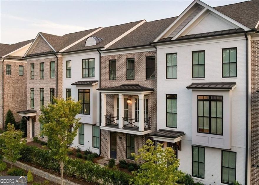 From great shopping at Avalon, to wonderful dinners on the Alpharetta square and connecting them all is the 7-mile Alpha Loop that is conveniently located directly across the street from the epitome of luxurious living - Welcome Home to 220 Briscoe way, the Brownstone Collection at Towns on Thompson. Moments from all the hottest spots in Alpharetta, yet world's away, in a thoughtfully designed retreat that captures every hope you've dreamed in modern townhome living. Wide plank hardwood floors, double french doors leading to the peaceful front balcony overlooking Thompson street, to the high ceilings with artisan lighting and smart home dimmer switches throughout! One of the BEST floorplans you'll find in Downtown Alpahretta- this truly is an true entertainers dream. With a massive kitchen island, 36" gas cooking, wine fridge + dry bar, tremendous storage (don't miss under the island!) and a wide, open concept flow, leaves plenty of dedicated space for all your introverted and extroverted guests! The upcoming Holiday parties you're about to host will be the hottest talk among all your friends and family! High tech touches like the "one-click" automatic custom blinds throughout the entire home, are designed for an easy night in, once all your guest have left and it's time to unwind. Luxury finishes and customized smart home details across all three levels. Portions of the builder's 2-10 warranty remain + all the TV's and Sonos sound systems are your new home starter pack for easy living on Thompson street. Not to mention, the upgraded "High Clearance" garage door rails ideal for SUV trunk openings, to unload your latest haul from Avalon or Whole foods just around the corner! The best floorplan, in the most highly sought after location, with all the details you expect in luxury living - is an exceptional recipe for your brightest days ahead!!