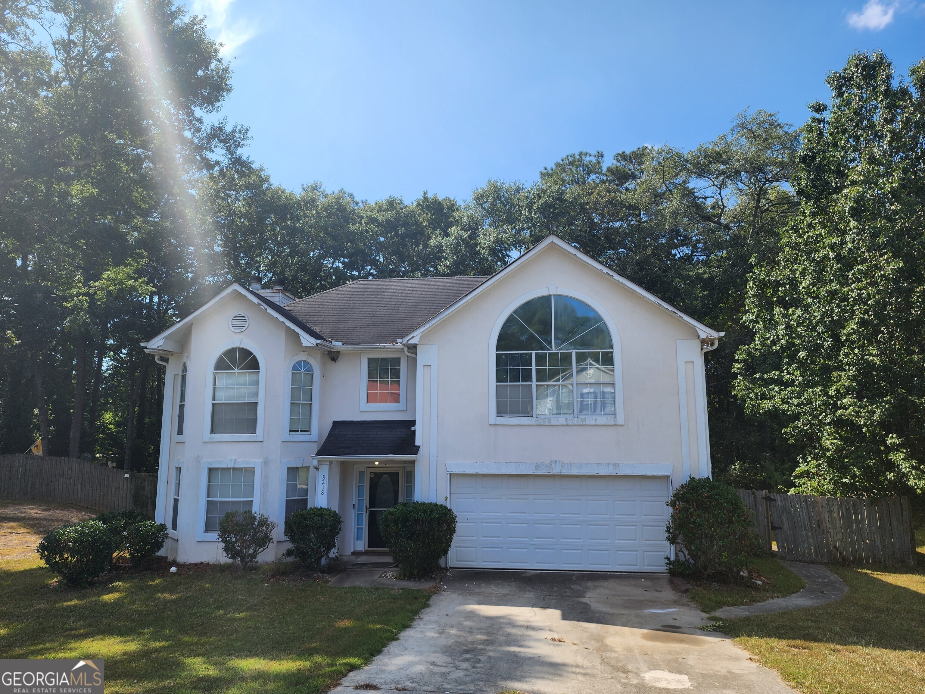Fantastic Investment Opportunity! This spacious 4-bedroom, 2.5-bath home is nestled in the quiet Sierra Ridge neighborhood of Lithonia. Ideal for savvy investors or owner-occupants. The welcoming family room features a cozy fireplace and bay window, and flows seamlessly into the separate dining area. The bright, oversized kitchen offers ample cabinet and counter space, and overlooks a sunny breakfast room. Double French doors lead to a large, fully fenced backyard, ideal for entertaining, pets, or play. Retreat to the expansive master suite, complete with its own fireplace, trey ceiling, bay window, and a spacious ensuite featuring a garden tub, separate shower, and generous walk-in closet. Additional highlights include well-sized secondary bedrooms with ample closet space and a convenient location close to shopping, schools, restaurants, and parks.