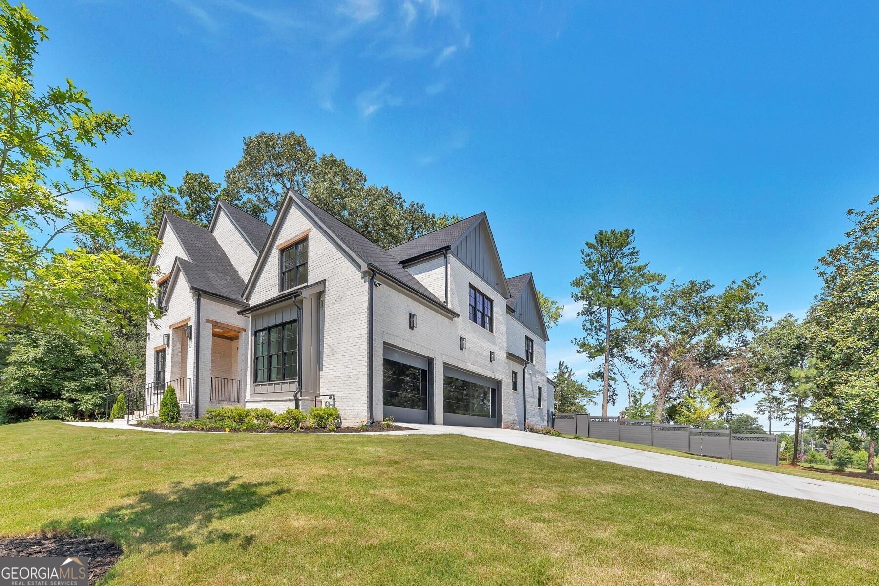 Another Construction by YSB Homes and Developments. Absolutely stunning New construction featuring 5 ensuite bedrooms and a glamorous powder room. This masterpiece aesthetics both interior and exterior is luxury design taken to the next level. With a striking entry wood Paneled wall, also a great room with custom steel and glass doors, the openness of the space transcends you to a place of style and serenity, In the kitchen, custom cabinetry showcasing high-end hardware is the perfect complement to the quartz countertops, checkout the custom ultra-modern steel and glass garage doors, and the elite appliance package ready for any chef inspired gourmet meals or to enjoy a glass of wine. With a guest suite on the first level which also double as PRIMARY ON MAIN Level suite with another spacious vaulted primary suite upstairs, you can unwind in your magazine-ready bathroom that has a freestanding Stone soaking tub and rain shower to enjoy after a long day. The spacious secondary bedrooms and bathrooms are designed to perfection. Enjoy your evenings in the back porch overlooking the lush green backyard, outdoor fireplace, and grilling pad. The unfinished terrace with a large future entertainment area is perfect for a home theater or screening room. Backyard has Room for a POOL! Superb location, within walking distance to Abernathy Tennis Courts, Abernathy Park, City Springs, restaurants, stores, etc. The Heards Ferry/Ridgeview/Riverwood cluster school district is an International Baccalaureate program from PK to 12 offering an excellent choice for education. Also, several private schools are within walking distance. No detail has been overlooked!