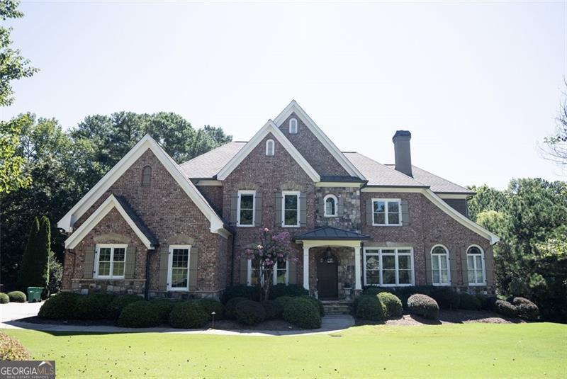 Welcome to one of the finest homes in Bear's Best, nestled within the sought-after, Jack Nicklaus-designed Bear's Best Golf Course community. This extraordinary residence is perfectly positioned in a quiet cul-de-sac, offering unmatched privacy, timeless curb appeal, and one of the few expansive, level backyards in the entire neighborhood-a true rarity in this golf course enclave! Spacious and beautifully maintained, this home showcases impeccable craftsmanship throughout-from the extensive millwork and tray ceilings to the rich hardwood floors and abundant natural light pouring through every room. Step inside and be captivated by the elegant flow of the main level, which features a guest suite with full bath, a grand great room, and a formal dining room perfect for entertaining. The chef-inspired kitchen is designed to impress with its pot filler, double ovens, generous island, and open breakfast area overlooking the cozy keeping room, complete with stone fireplace and custom built-ins. But the outdoor living is where this home truly shines. You'll love the oversized, flat backyard-a rare gem in this community-ideal for play, pets, or future pool. Enjoy multiple seating areas, including a 6-person dining table, outdoor sofas, and a fire pit surrounded by chairs-your private retreat for gatherings under the stars. The luxurious primary suite offers a personal sanctuary with its own sitting room, fireplace, custom built-ins, and a spa-like bath with dual vanities, soaking tub, walk-in shower, and a massive walk-in closet. A private office and adjoining bar area complete this perfect retreat. Upstairs, you'll find generously sized bedrooms, each with access to private or Jack-and-Jill baths, and a bright landing area connecting the spaces. The unfinished terrace level with high ceilings offers endless potential to create the basement of your dreams. This home also boasts two expansive outdoor living spaces, making it a true entertainer's dream. Enjoy resort-style amenities including an Olympic-sized pool with waterslide and swim team, tennis courts, basketball, fitness center, playground, and a vibrant social calendar year-round. Located just minutes from the Chattahoochee River, Suwanee Town Center, Lake Lanier, and top-tier dining, shopping, and award-winning schools. Don't miss your chance to own this rare find with one of the largest, flattest backyards in Edinburgh! Contact us today for a private showing and ask for the full list of upgrades!