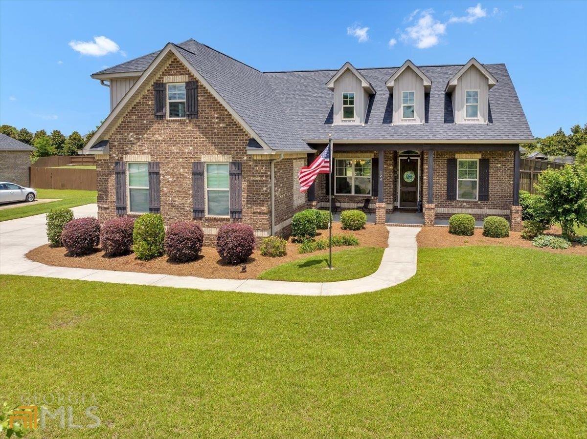 Yearning to live in Perry? Now is your chance! Situated in one of Perry's most sought-after neighborhoods, Stonegate, this beautiful brick home boasts a charming rocking chair front porch, fireside living room and an abundance of natural light. The kitchen features stainless steel appliances, beautiful countertops, and an ample cabinet space. Enjoy the view from the breakfast nook into the beautiful private backyard!
