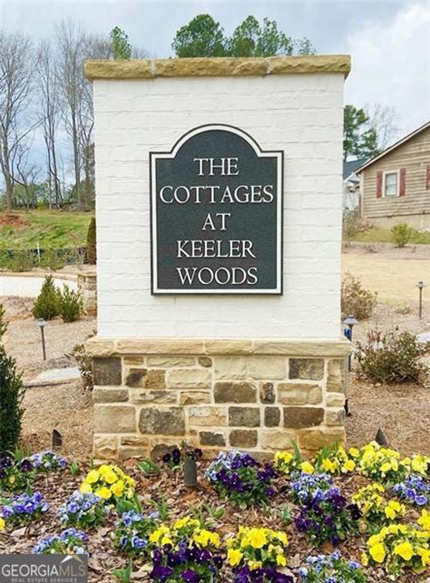 Fantastic opportunity to purchase a beautiful lot and build a custom home in the exquisite neighborhood of The Cottages at Keeler Woods - located close to the Historic Marietta Square, Kennesaw Mountain and in West Side Elementary district. Lot can be purchased with adjoining lot 21 if a double lot is desired.  Custom home must be designed by Caldwell Cline and built by Elliott Custom Homes. Lot sits across from the neighborhood green space where you can enjoy use of the community pergola and fire pit. Several pre-designed house plans by Caldwell-Cline are also available to use. The Neighborhood is gated and in a great location close to area shopping, restaurants, and schools!