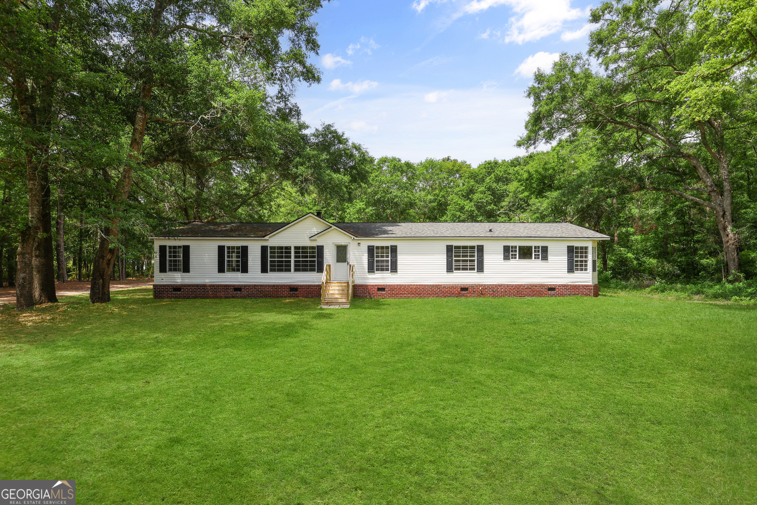 Price Improvement! Motivated Seller! Welcome to your private country retreat! This beautifully updated home of 4 beds/2baths sits on over 6 acres of peaceful land, offering space, serenity, and endless possibilities. Inside, you'll find fresh new carpet and paint throughout, giving the home a clean, modern feel. Whether you're looking for a full-time residence or a weekend getaway, this property offers comfort and room to grow. Enjoy the freedom of wide-open space, bring your animals, and start a garden. Did I mention it has an amazing workshop? It could even be used as a man cave, she-shed. Don't miss this rare opportunity to own this much acreage with move-in-ready living!
