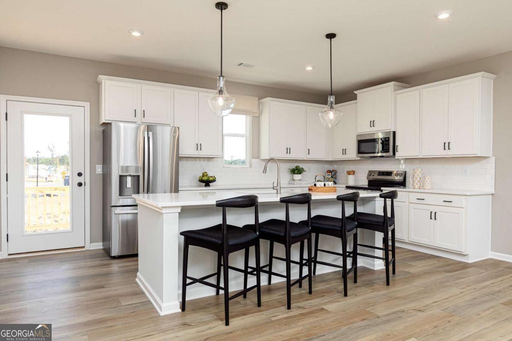 Photo of 3535 Tristens Cove Walk, Loganville, GA 30052 (MLS # 10742532)