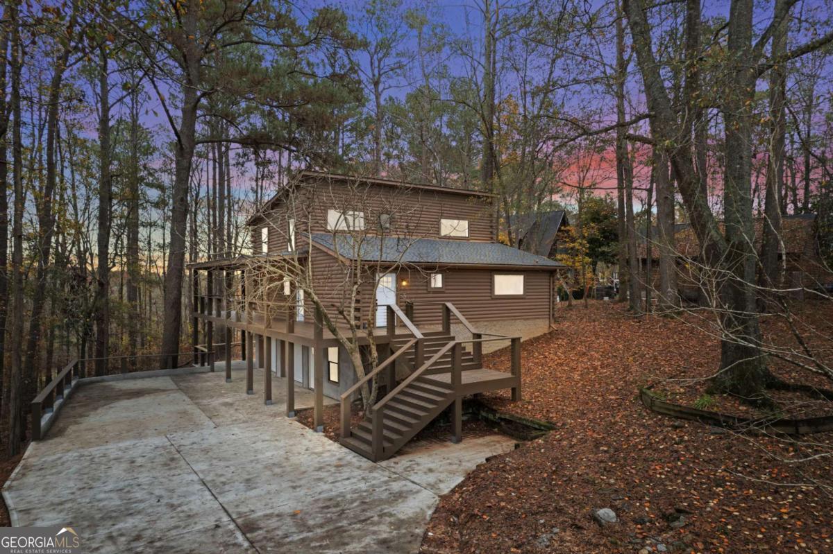 Welcome to this stunning lakehouse completely renovated and updated with all new appliances, A/C, water heater, and roof. No detail was overlooked; from wider exterior stairs, to an added covered wrap around porch, this home will not disappoint. Situated on a sprawling 1-acre lot with deep water access to West Point Lake, this property is not just a home; it's an invitation to a waterfront lifestyle. With 5 bedrooms and 3 bathrooms, including a main-level master, the interior spans 3,408 sqft of thoughtful design. Entertain effortlessly in the dining room/living room combo, where memories are crafted around the warmth of the living room fireplace. Enjoy the comfort of a finished basement, featuring a common area laundry and a finished bath for added convenience. Relish the three levels of living space, each offering views of West Point Lake. The covered wrap-around deck, poised for relaxation, overlooks a pristine lake view, while the dock beckons for sun-soaked afternoons. Architecturally adorned with log construction, this Contemporary and Country/Rustic cabin boasts a timeless charm. With a brand new roof, A/C, water heater, and countless other items and renovations, this home is ready for you to move right in. Don't miss your chance to own this slice of paradise on West Point Lake.