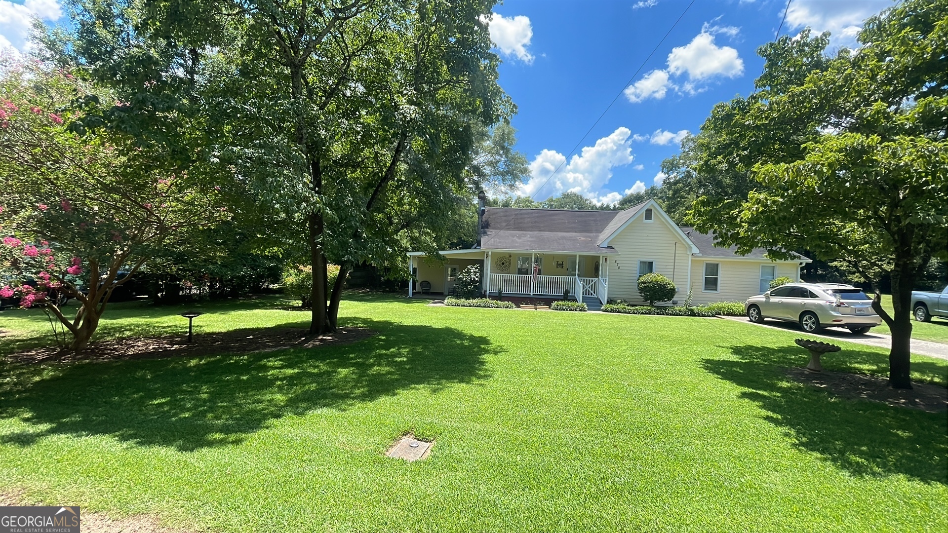 Live within walking distance to downtown Locust Grove landmarks. Sit on the front porch and enjoy this peaceful downtown area. This 4 bedroom 2 bath home with a bonus room that could be a 5th bedroom has endless possibilities. Newer carpet throughout the bedrooms and living room with wide hallways. The large master has its own deck and is open to the fenced back yard. Nice workshop with plenty of storage in the back. Plus an above ground pool. This house has endless possibilities.