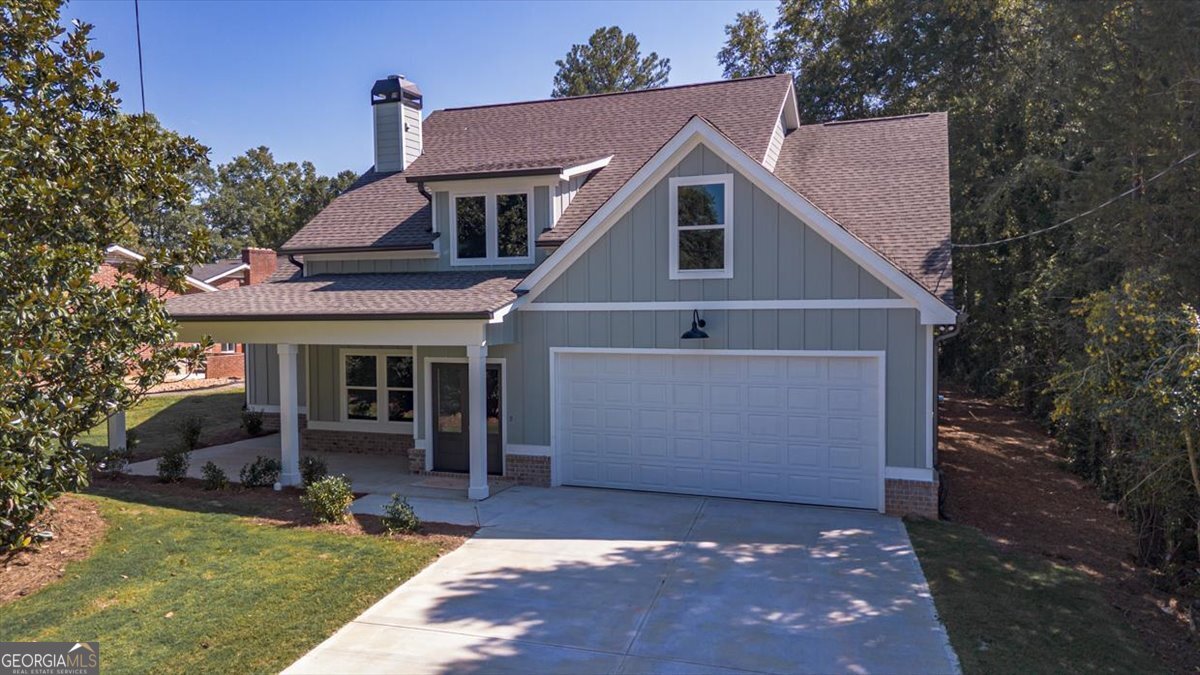 Don't miss this beautiful 3-bedroom, 2.5-bath home within the city limits! Designed for modern living, it features 9-foot ceilings and an open-concept layout. The kitchen is a chef's dream with granite countertops, a spacious island, a tile backsplash, and an oversized pantry. Relax by the wood-burning fireplace in the living room or retreat to the primary suite, complete with a freestanding tub, custom tile shower, double vanities, and a walk-in closet. The split floor plan offers privacy, with additional bedrooms and a bathroom on the opposite side of the home. Stylish and durable VLP flooring extends throughout the main living areas and bathrooms. Enjoy outdoor living on the oversized covered back porch, perfect for entertaining or unwinding. Need even more room? There is a bonus area that could be finished for an additional fee. Call Jami for more information! PLEASE NOTE: Plans may vary at the builder's discretion. Floor plan measurements are approximate. Do not enter the property without an agent's knowledge. Estimated completion: End of July 2025
